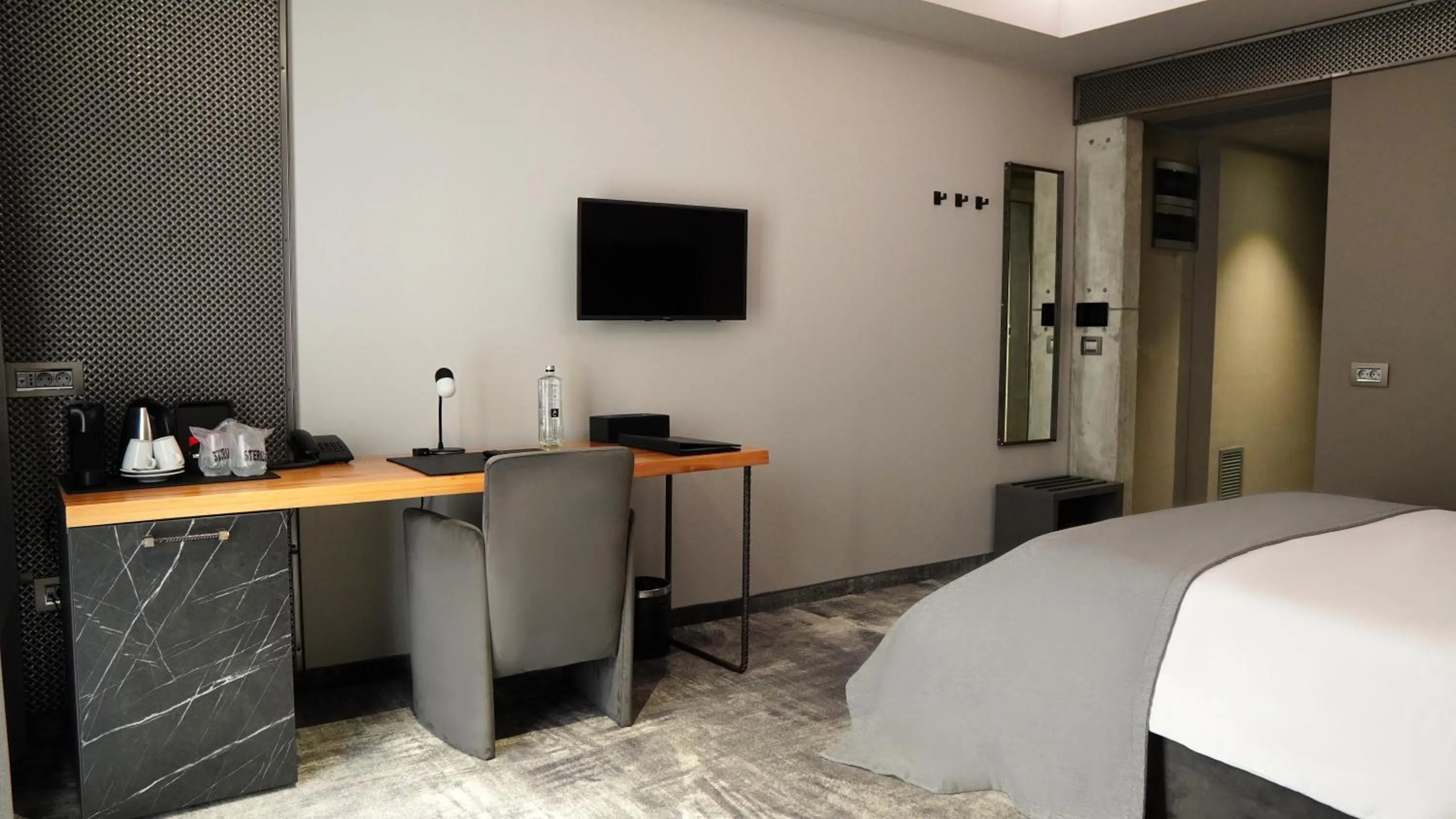 Bed in Aniroc Signature Hotel