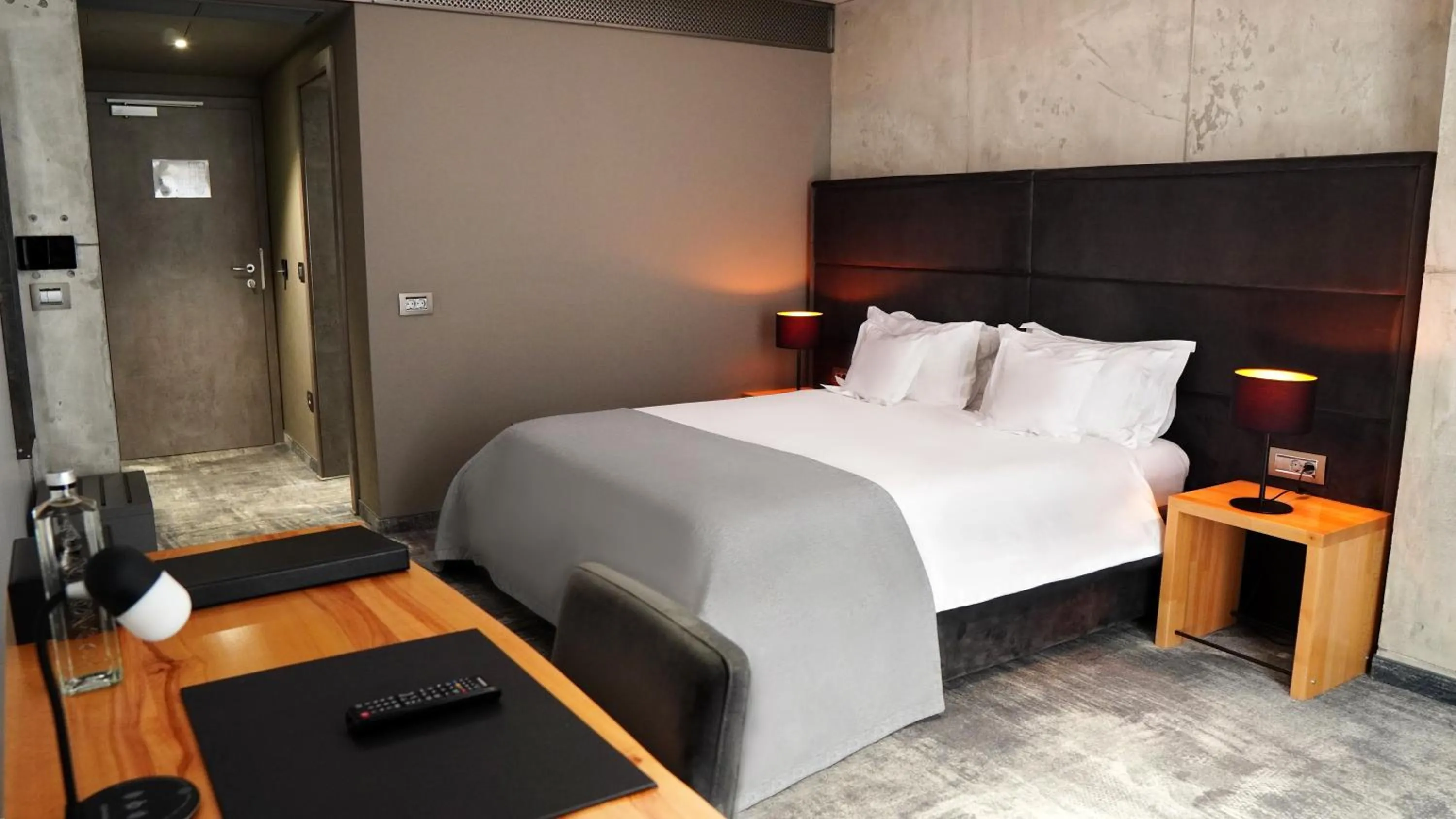 Bed in Aniroc Signature Hotel