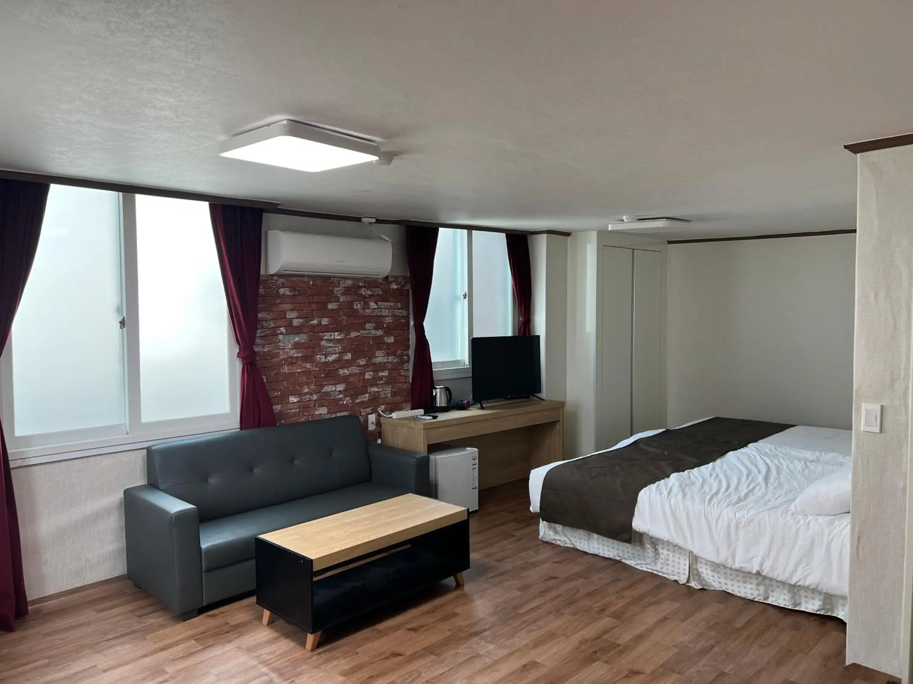 Living room, Bed in Bricks Stay Jeju City & Aiport Living room, Bed in Bricks Stay Jeju City & Aiport