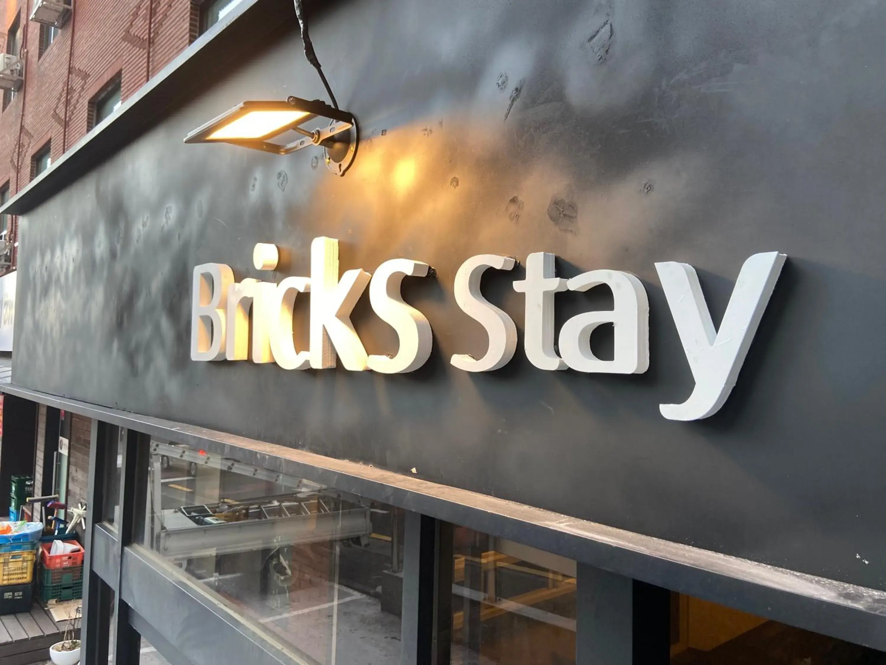 Property logo or sign in Bricks Stay Jeju City & Aiport Property logo or sign in Bricks Stay Jeju City & Aiport