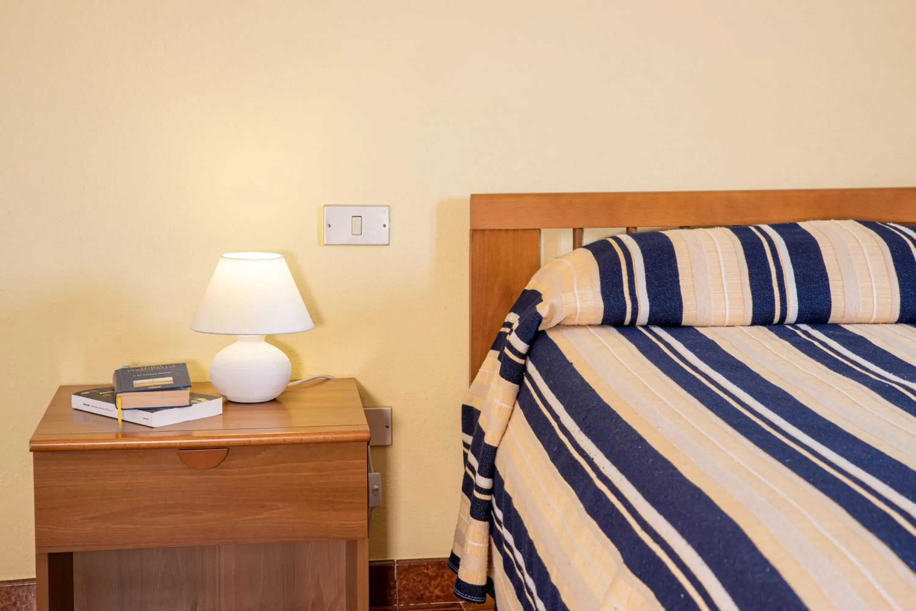 Bed in Hotel L'Aragosta Bed in Hotel L'Aragosta