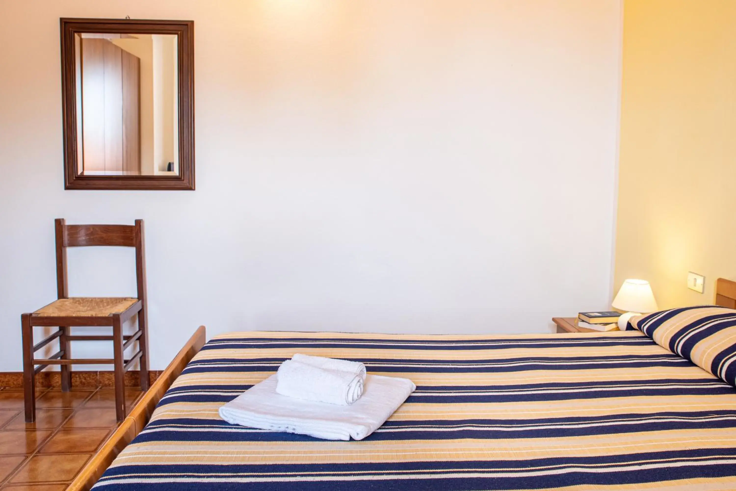 Bed in Hotel L'Aragosta Bed in Hotel L'Aragosta