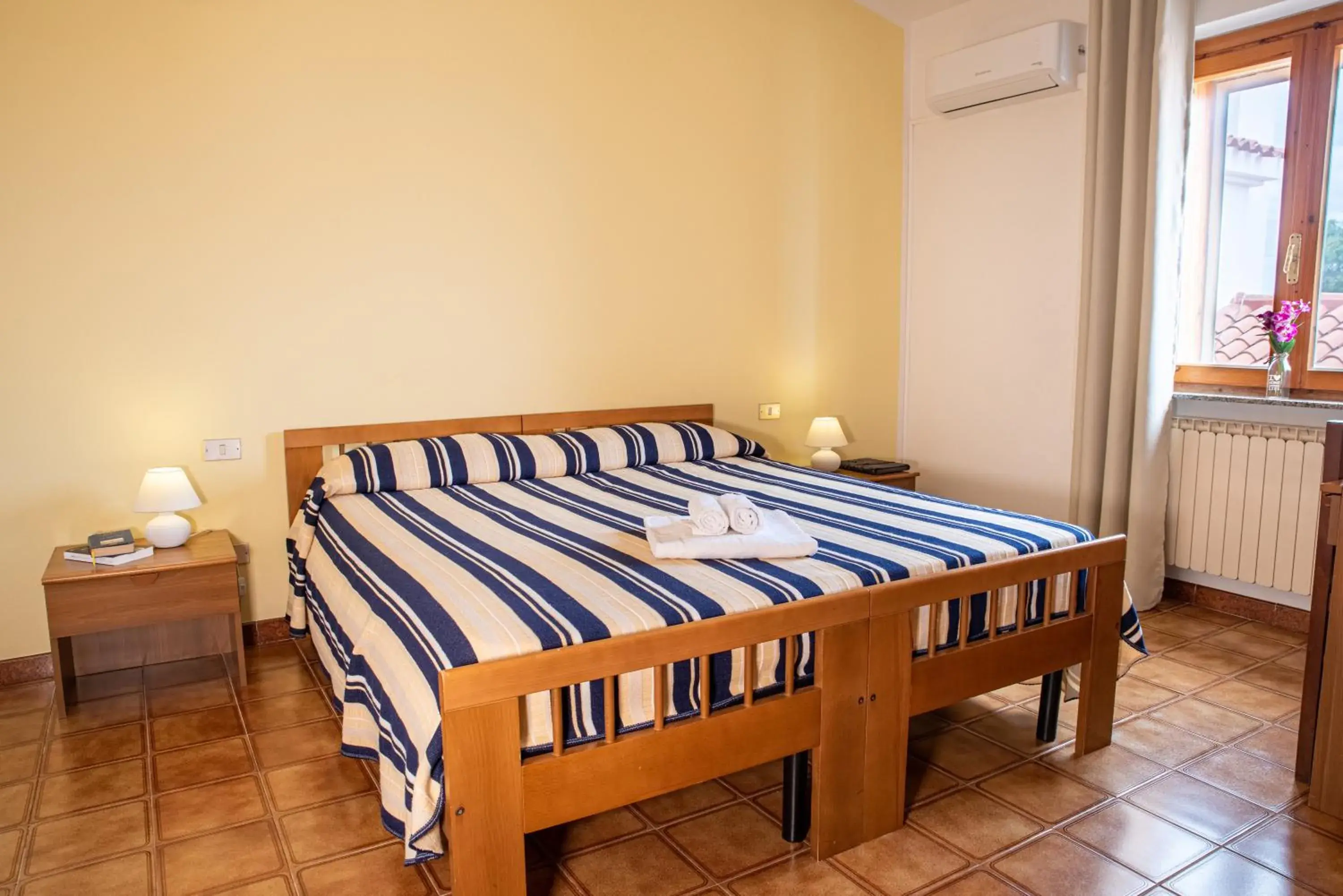 Bed in Hotel L'Aragosta Bed in Hotel L'Aragosta