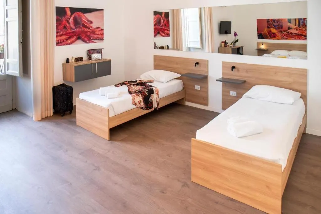 Bed in Ballaro' Hotel - Budget Room