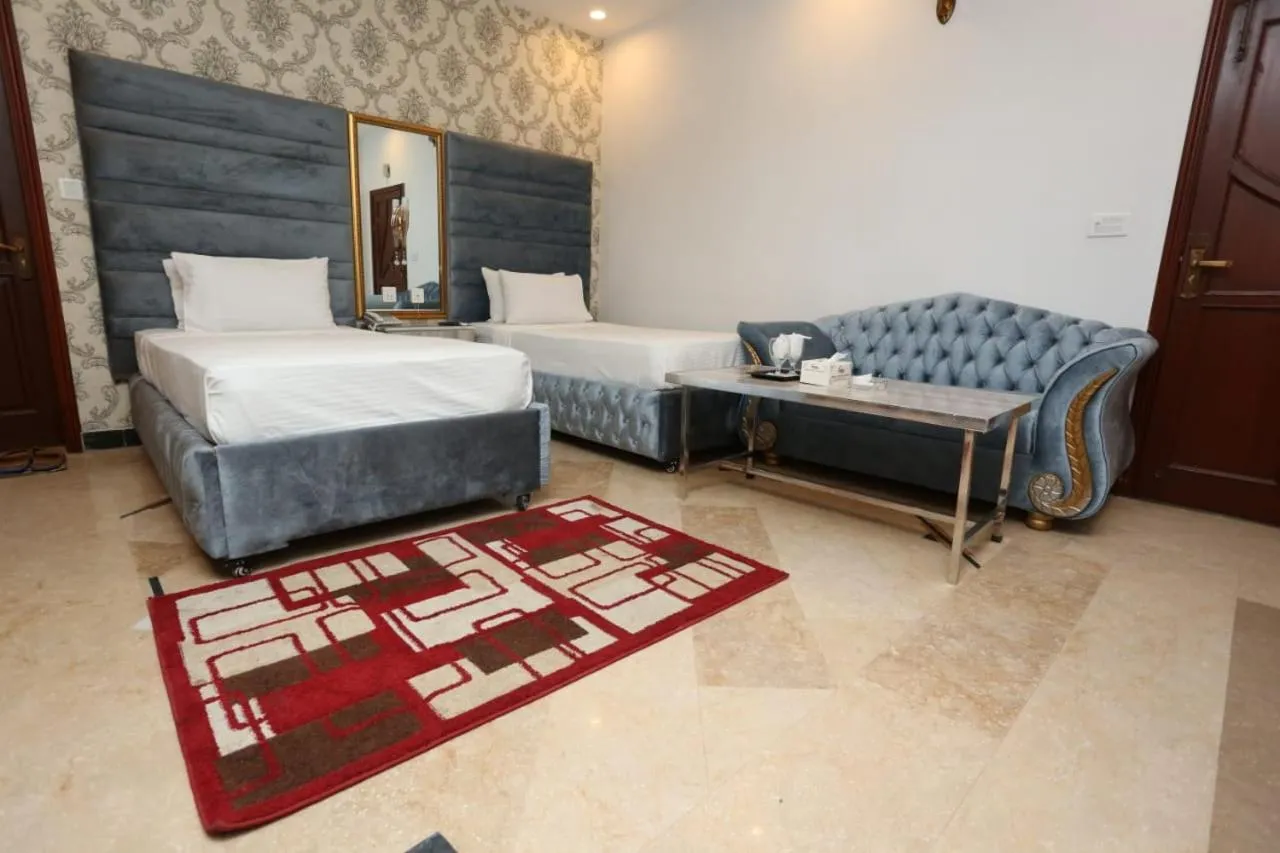 Photo of the whole room, Bed in Grand Swiss Hotel&Apartment Lahore