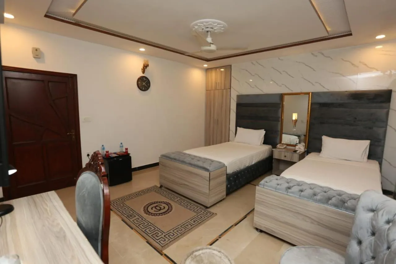 Photo of the whole room, Bed in Grand Swiss Hotel&Apartment Lahore
