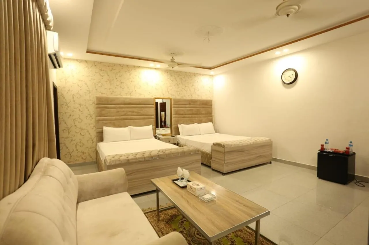 Photo of the whole room, Bed in Grand Swiss Hotel&Apartment Lahore