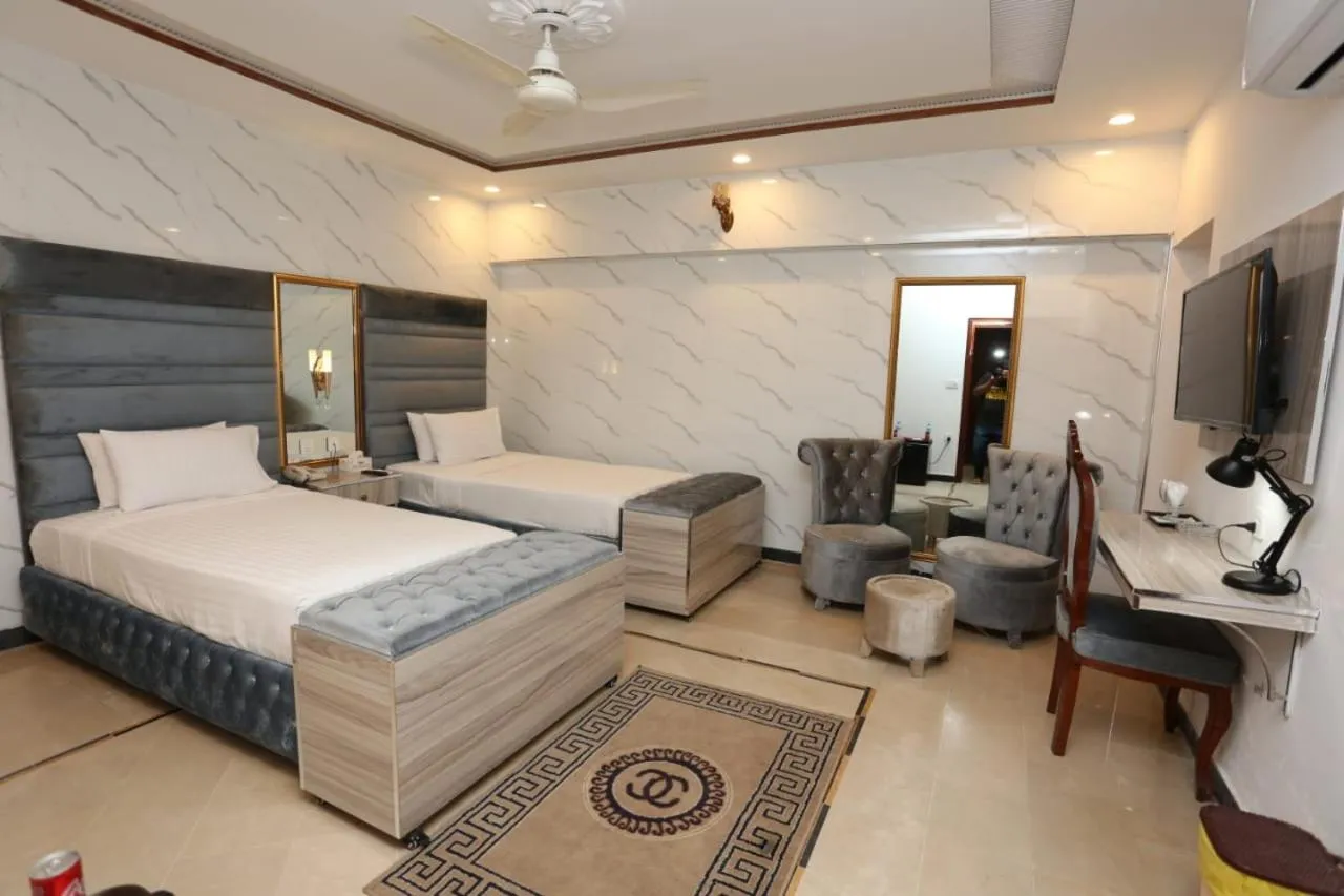 Bed in Grand Swiss Hotel&Apartment Lahore