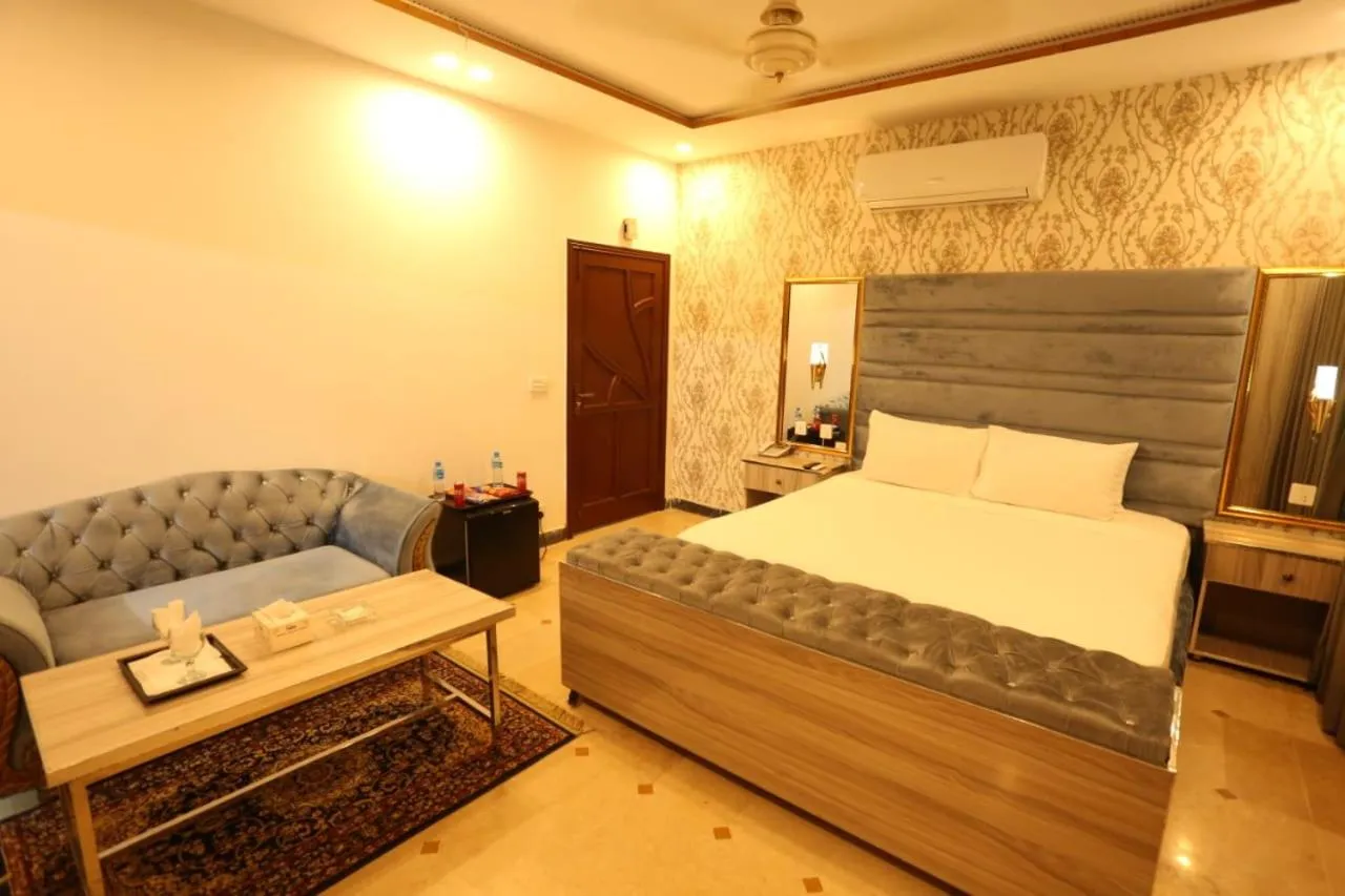 Bed in Grand Swiss Hotel&Apartment Lahore