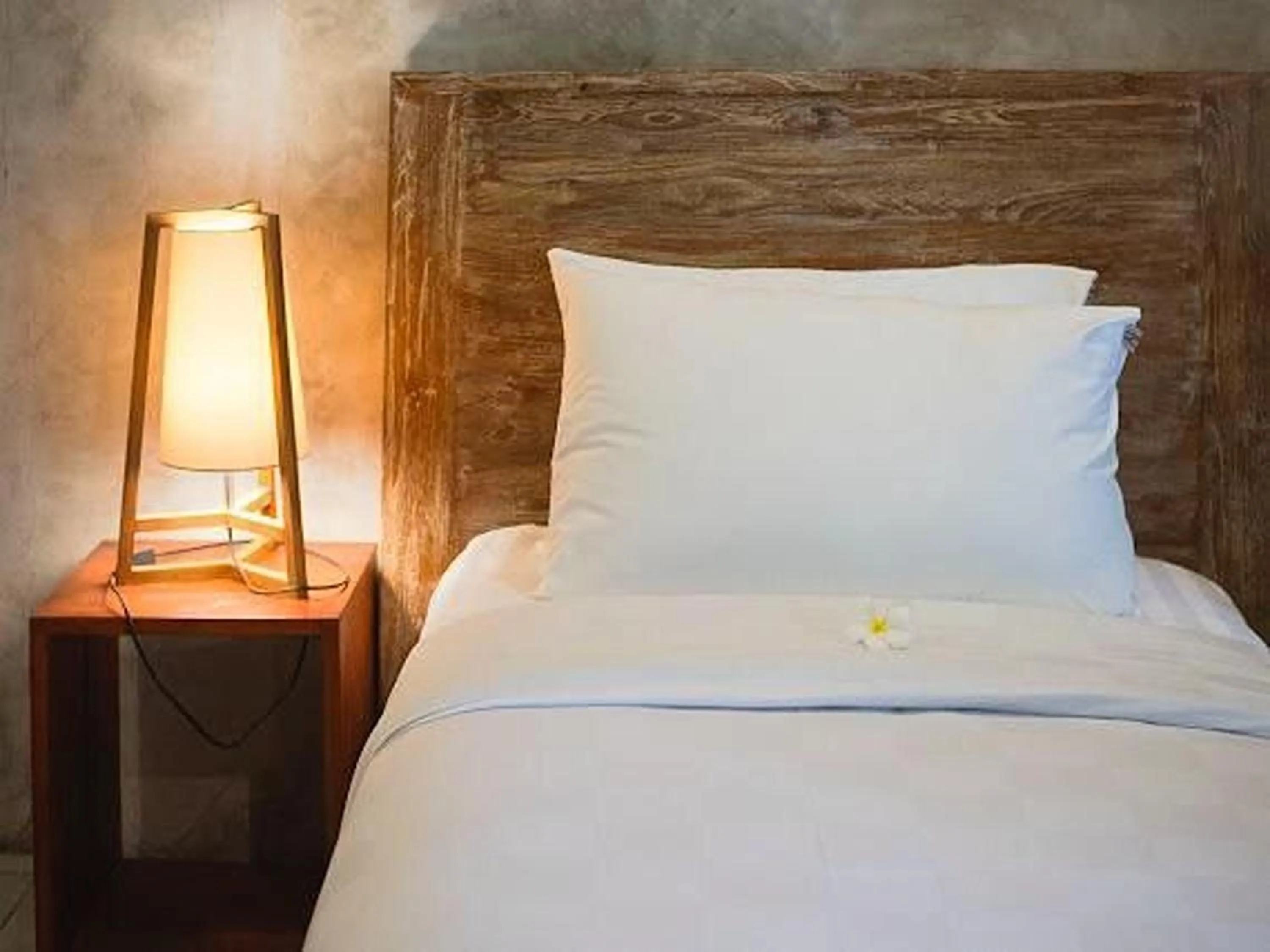 Bed in Nayaka Living Ubud