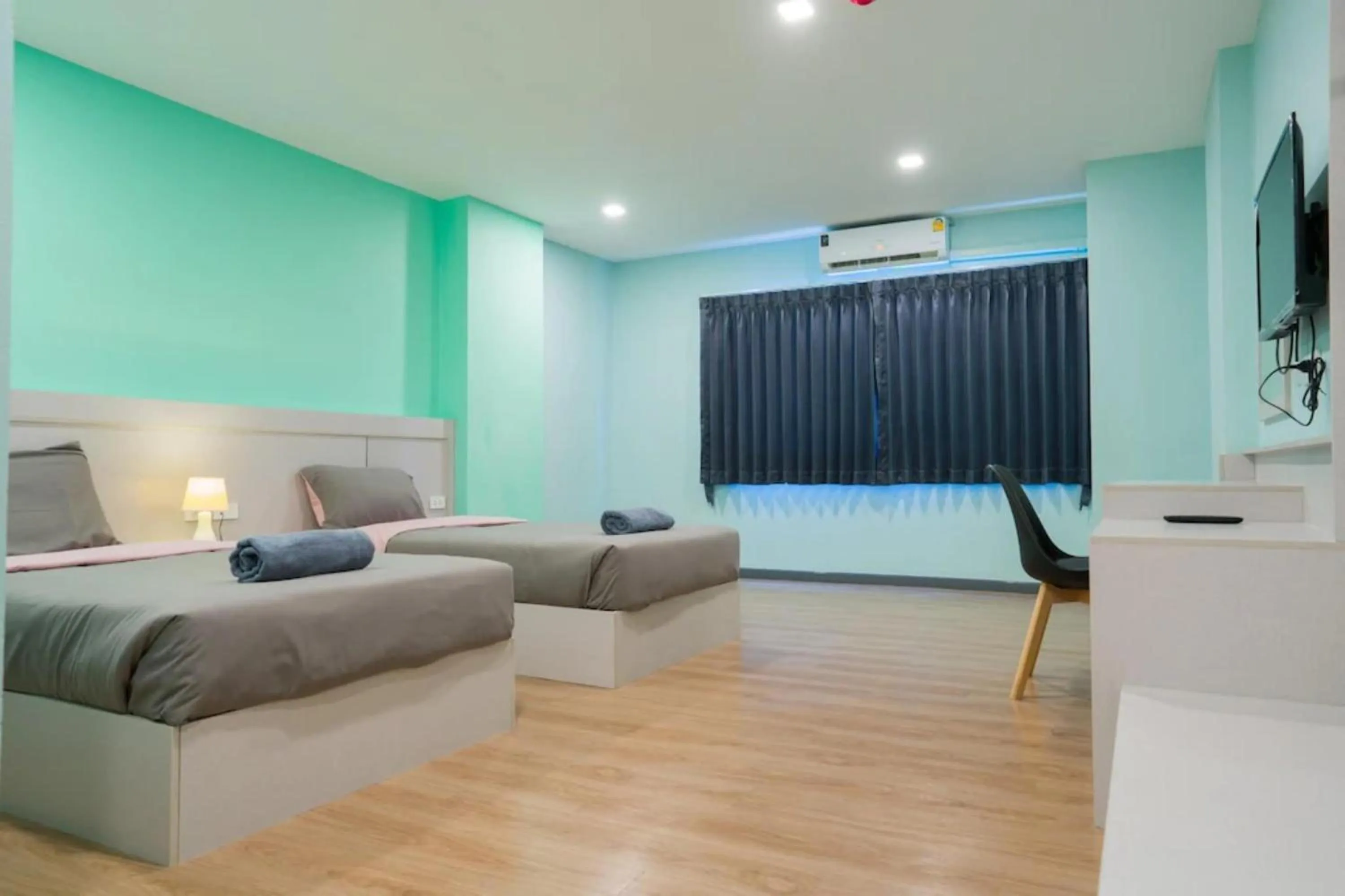 Living room, Bed in Sritrang Residence