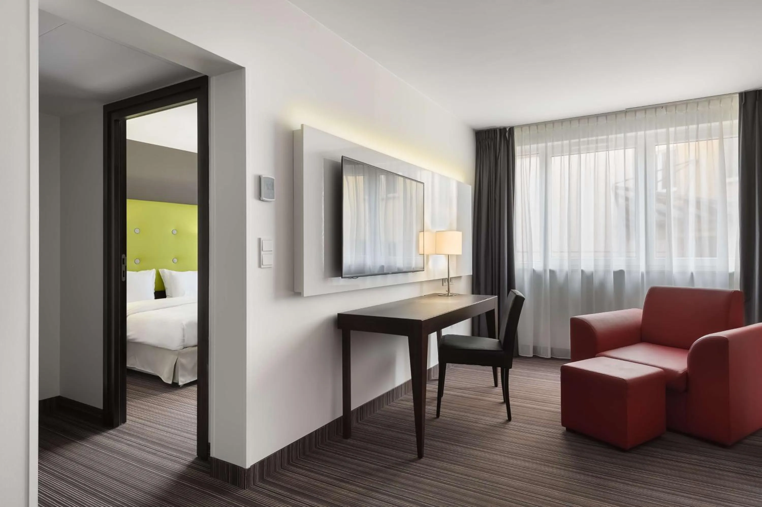 Communal lounge/ TV room, Bed in Radisson Blu Sobieski