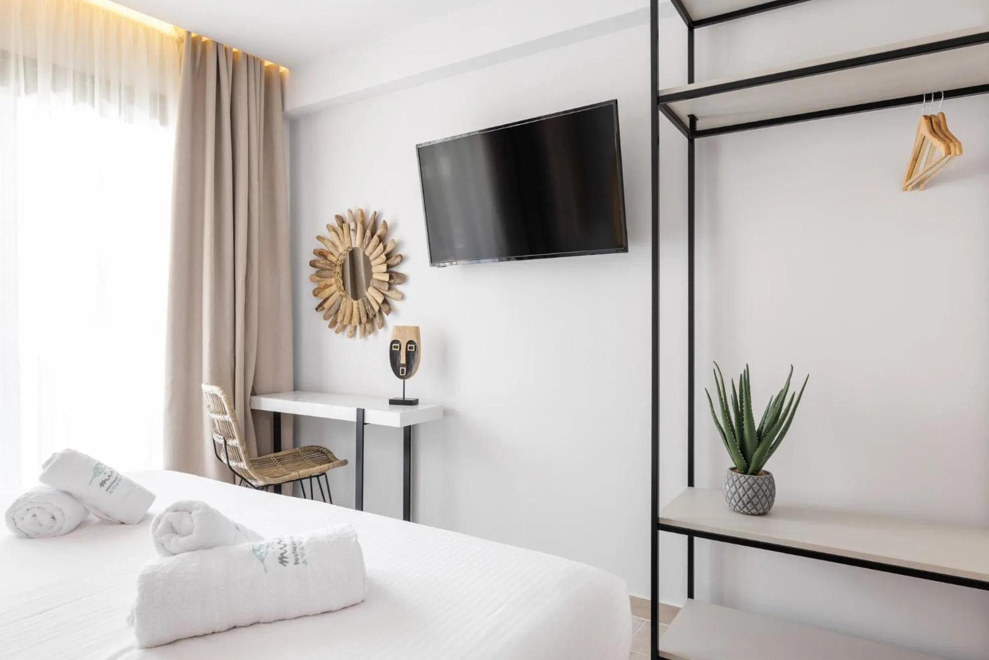 Bed in Amalthia Luxury Suites