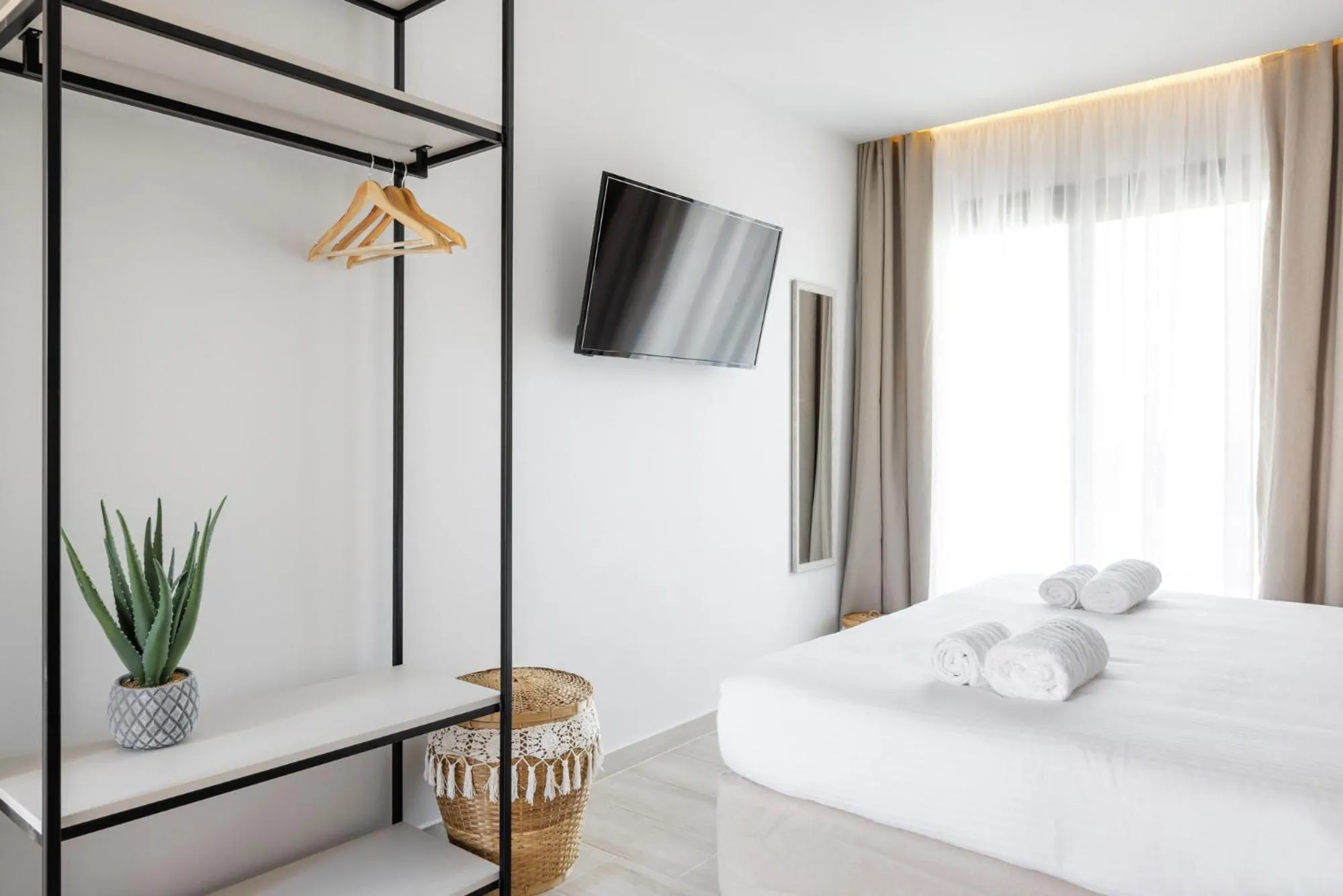 Bed in Amalthia Luxury Suites