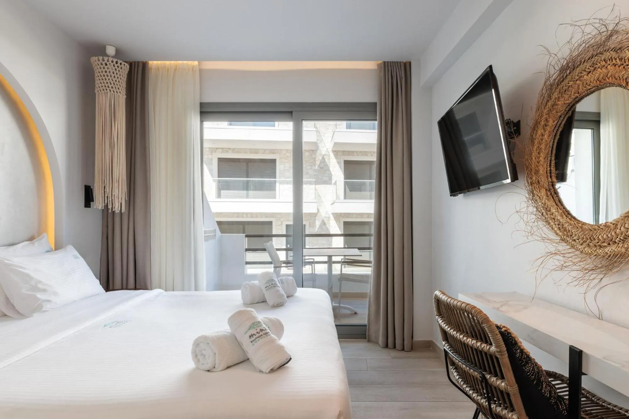 Bed in Amalthia Luxury Suites