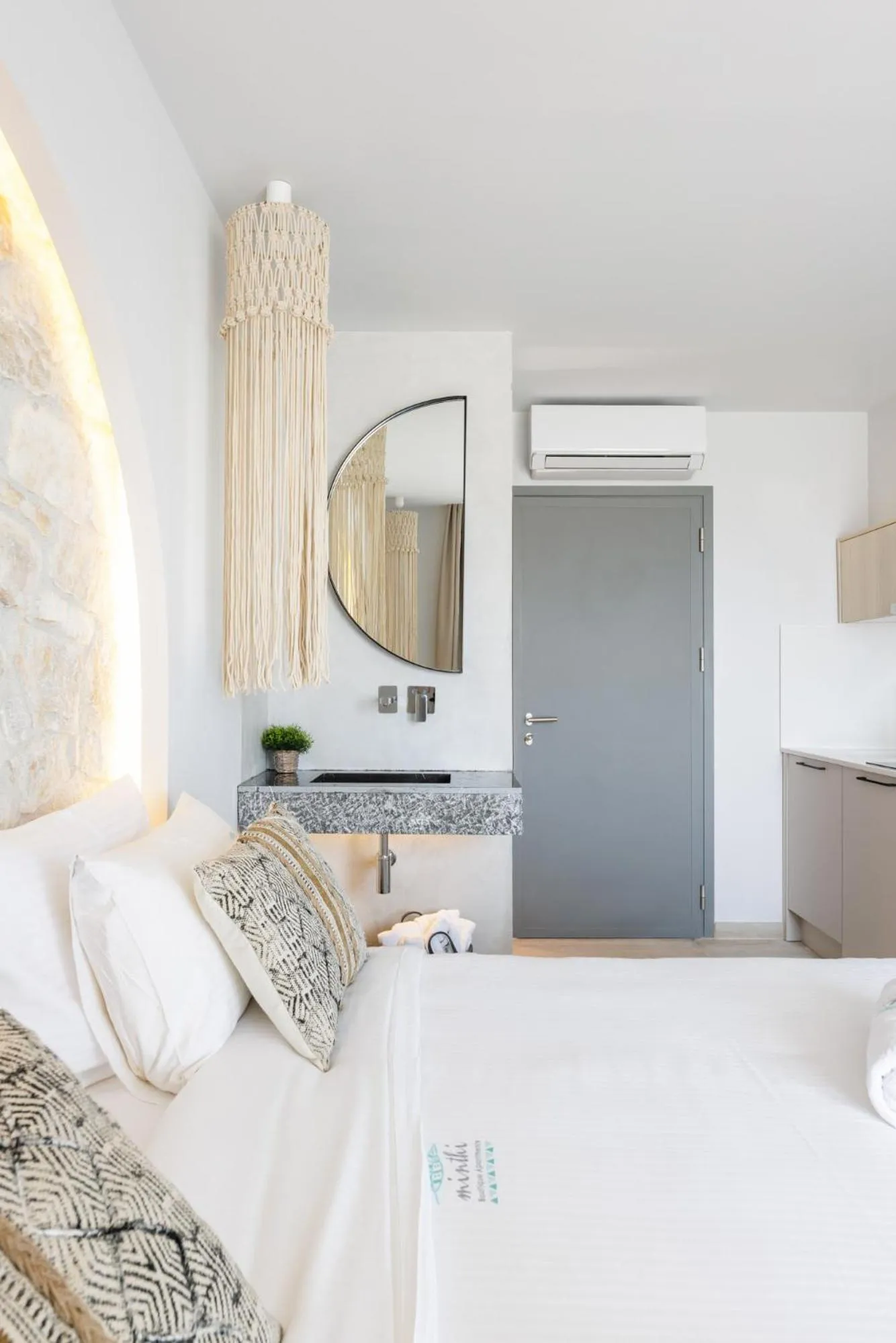 Bed in Amalthia Luxury Suites