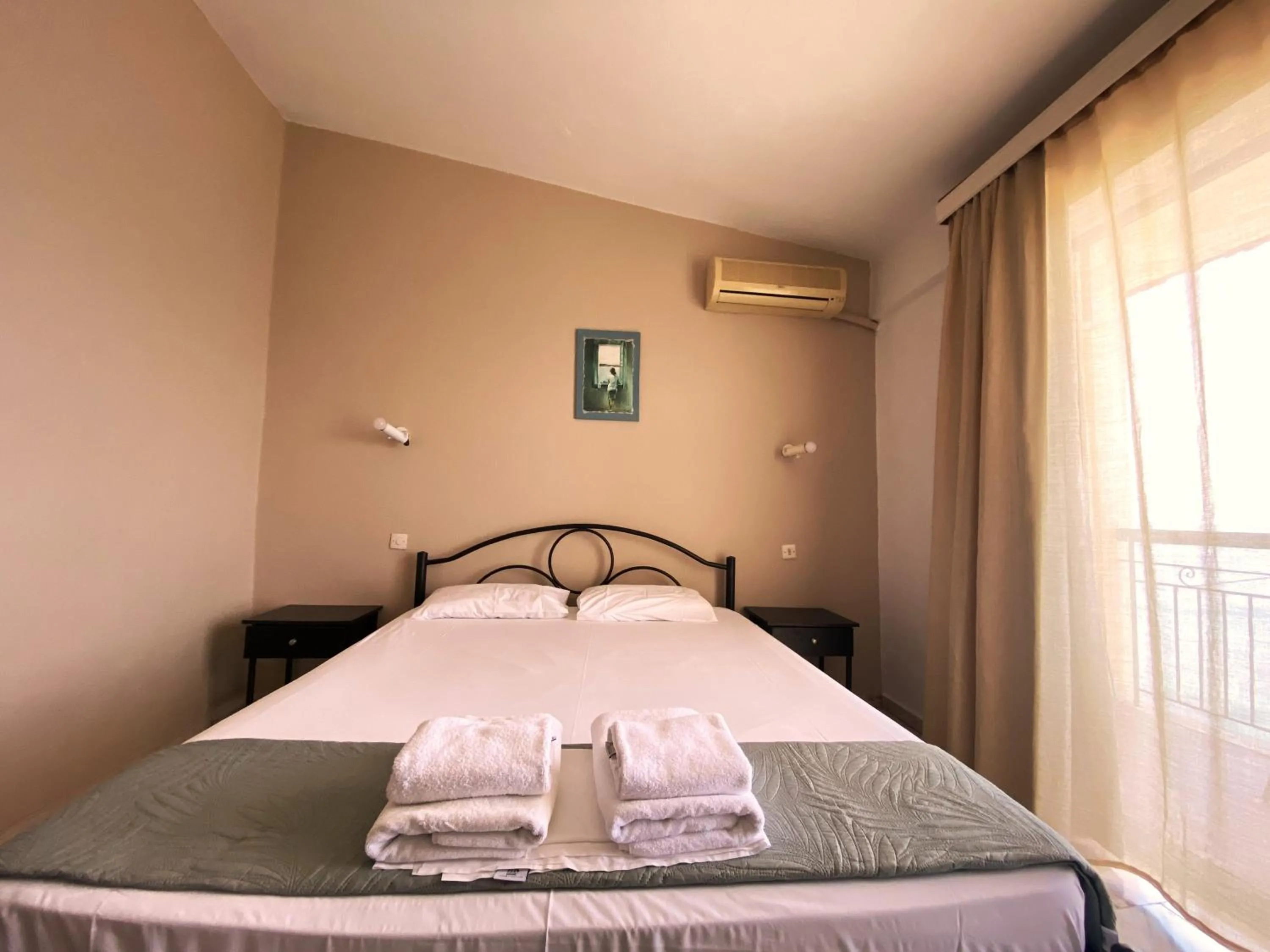 Bedroom in El Greco hotel by Estia