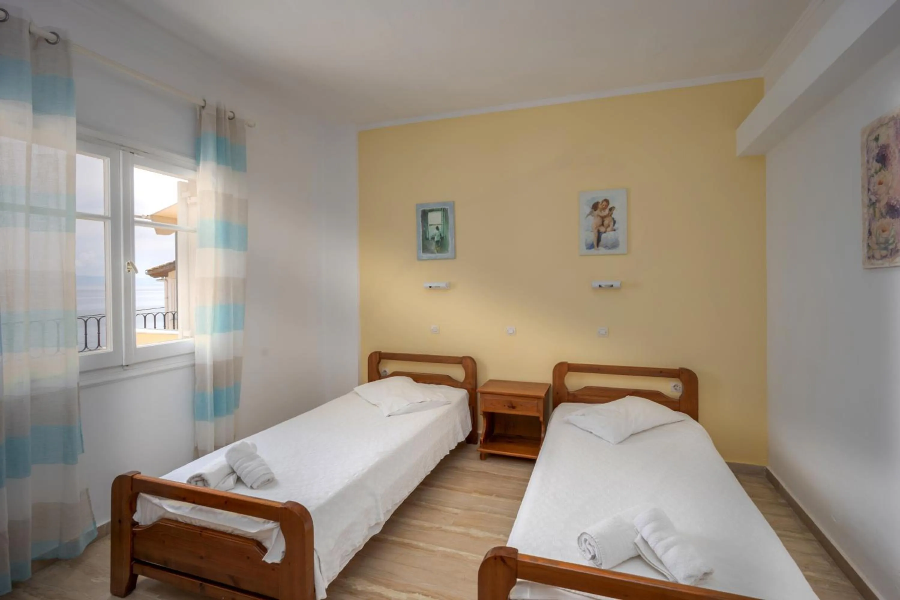 Bed in El Greco hotel by Estia