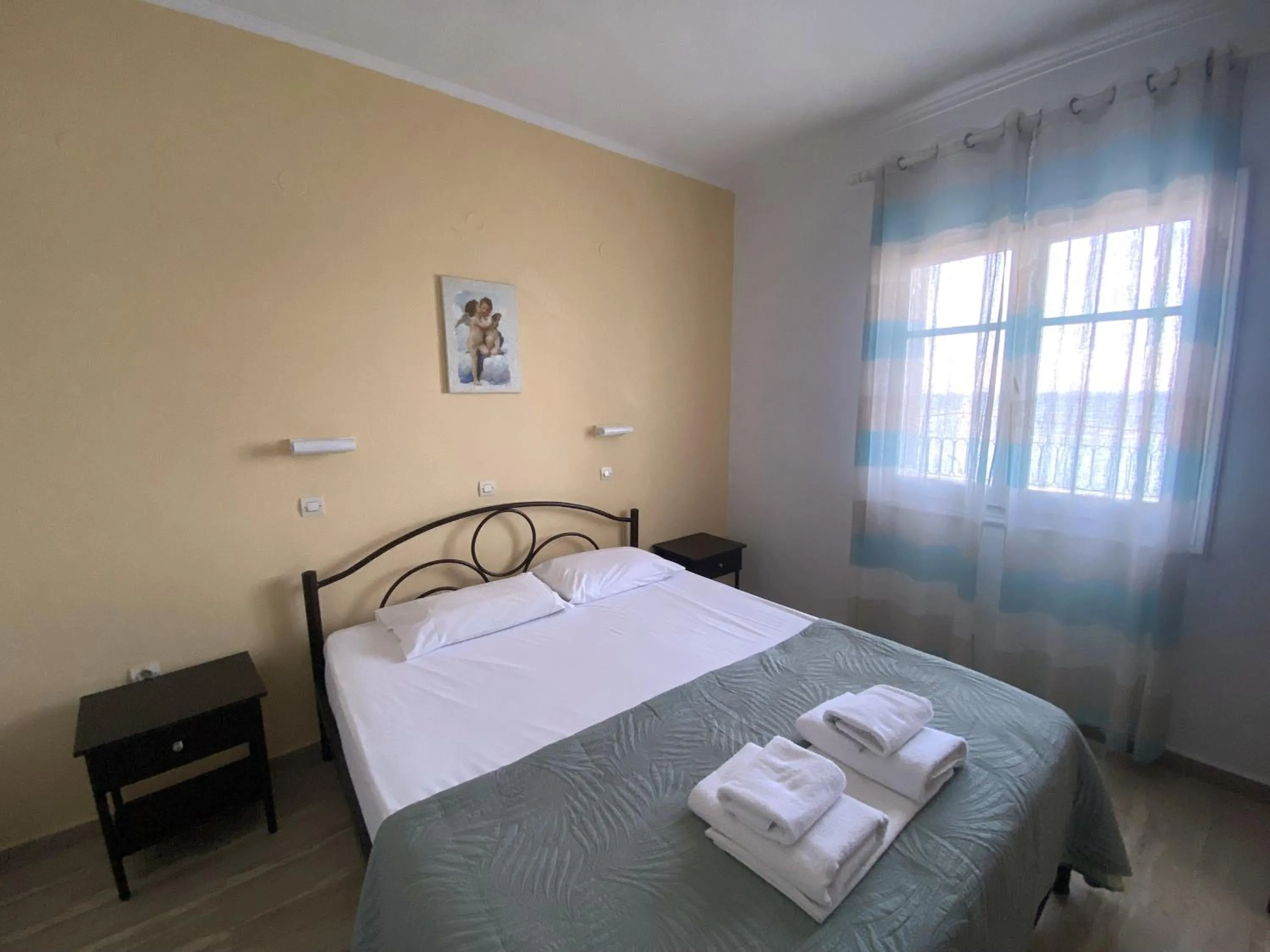 Bedroom in El Greco hotel by Estia