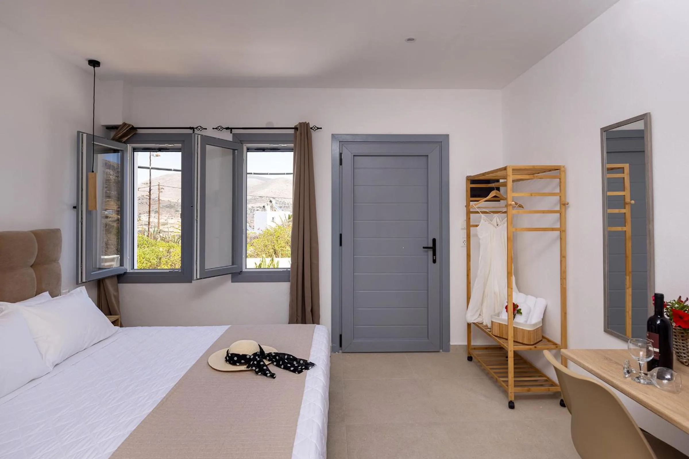 Photo of the whole room, Bed in Chrysonisos Suites with Sunset & Seaviews near Kini