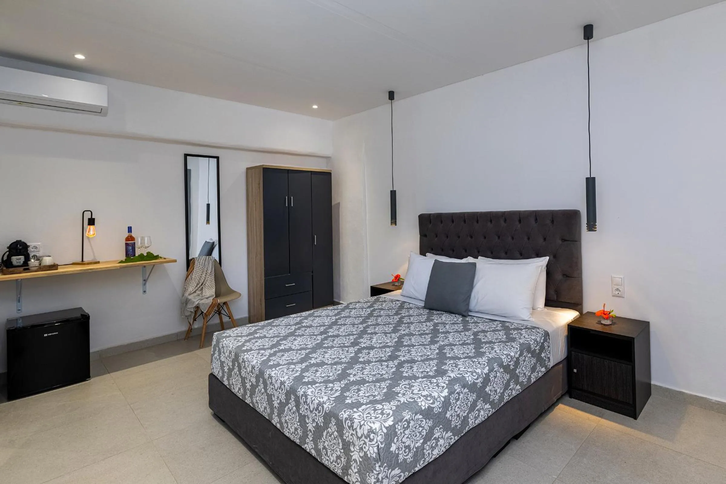 Bed in Chrysonisos Suites with Sunset & Seaviews near Kini