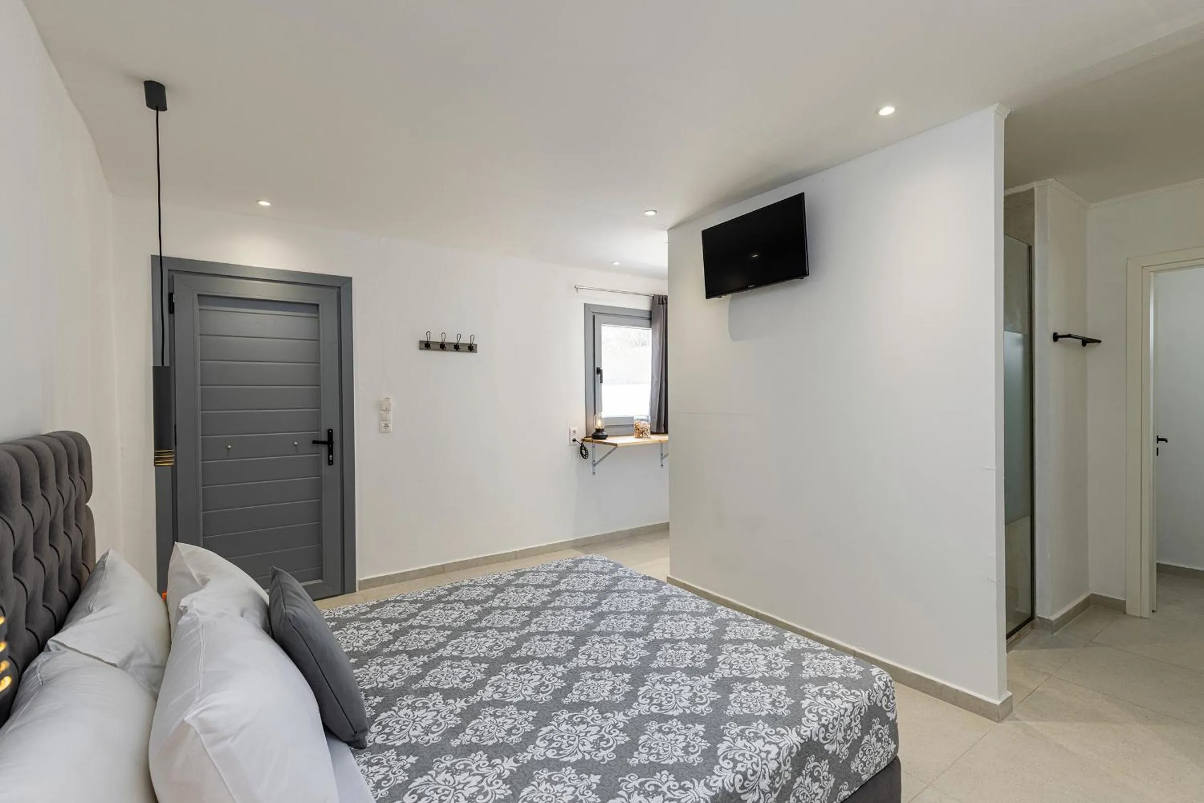 Bed in Chrysonisos Suites with Sunset & Seaviews near Kini