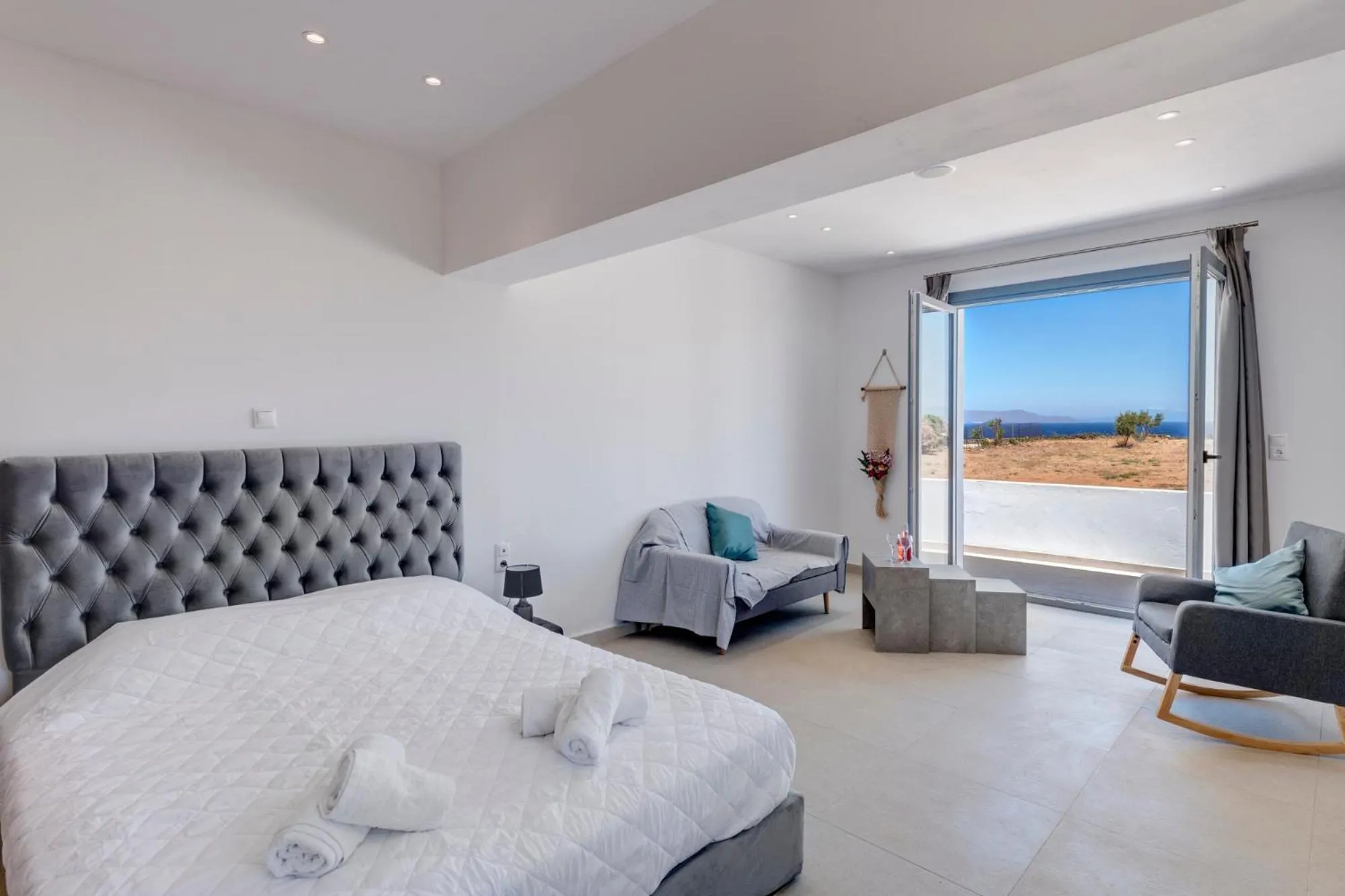 Bed in Chrysonisos Suites with Sunset & Seaviews near Kini