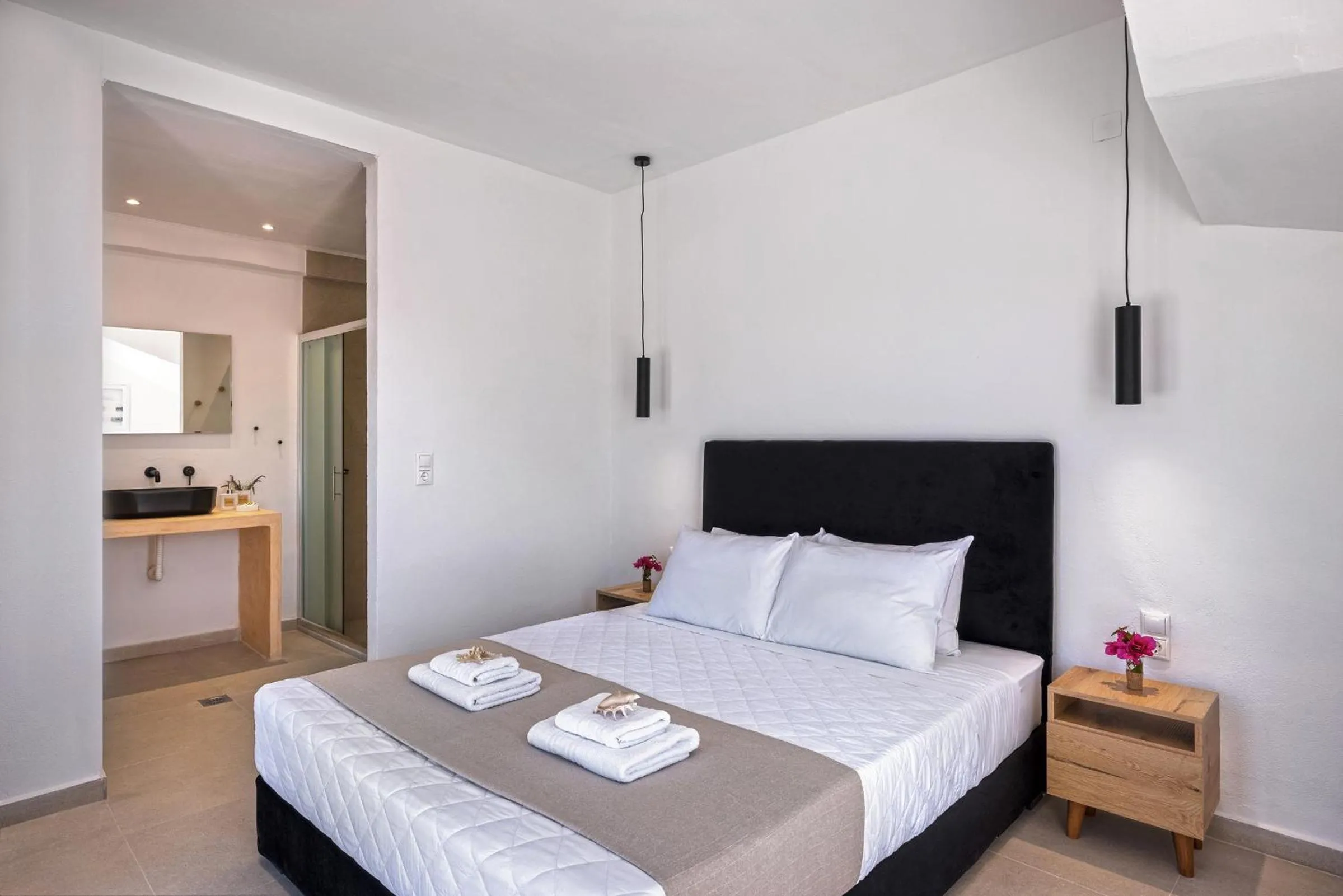 Bed in Chrysonisos Suites with Sunset & Seaviews near Kini
