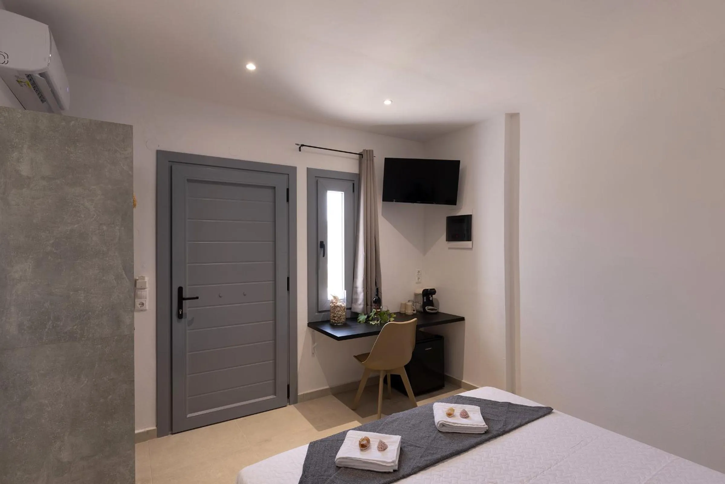 Bed in Chrysonisos Suites with Sunset & Seaviews near Kini