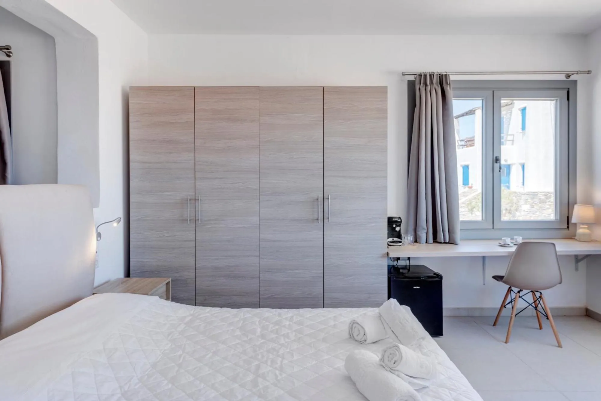 Photo of the whole room, Bed in Chrysonisos Suites with Sunset & Seaviews near Kini