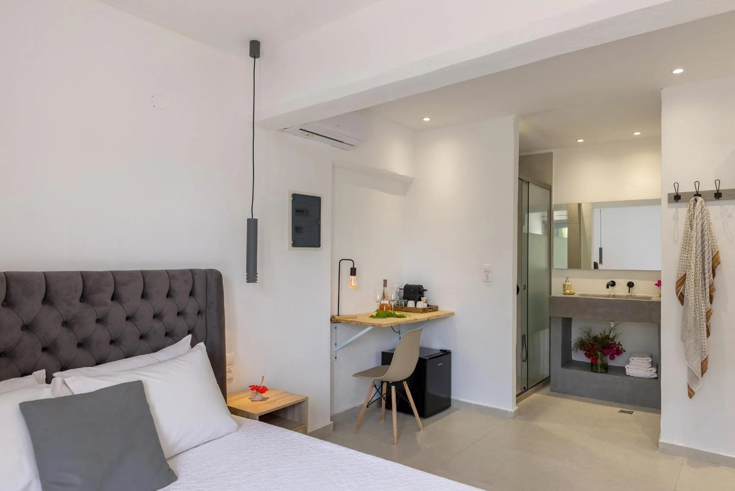 Bed in Chrysonisos Suites with Sunset & Seaviews near Kini