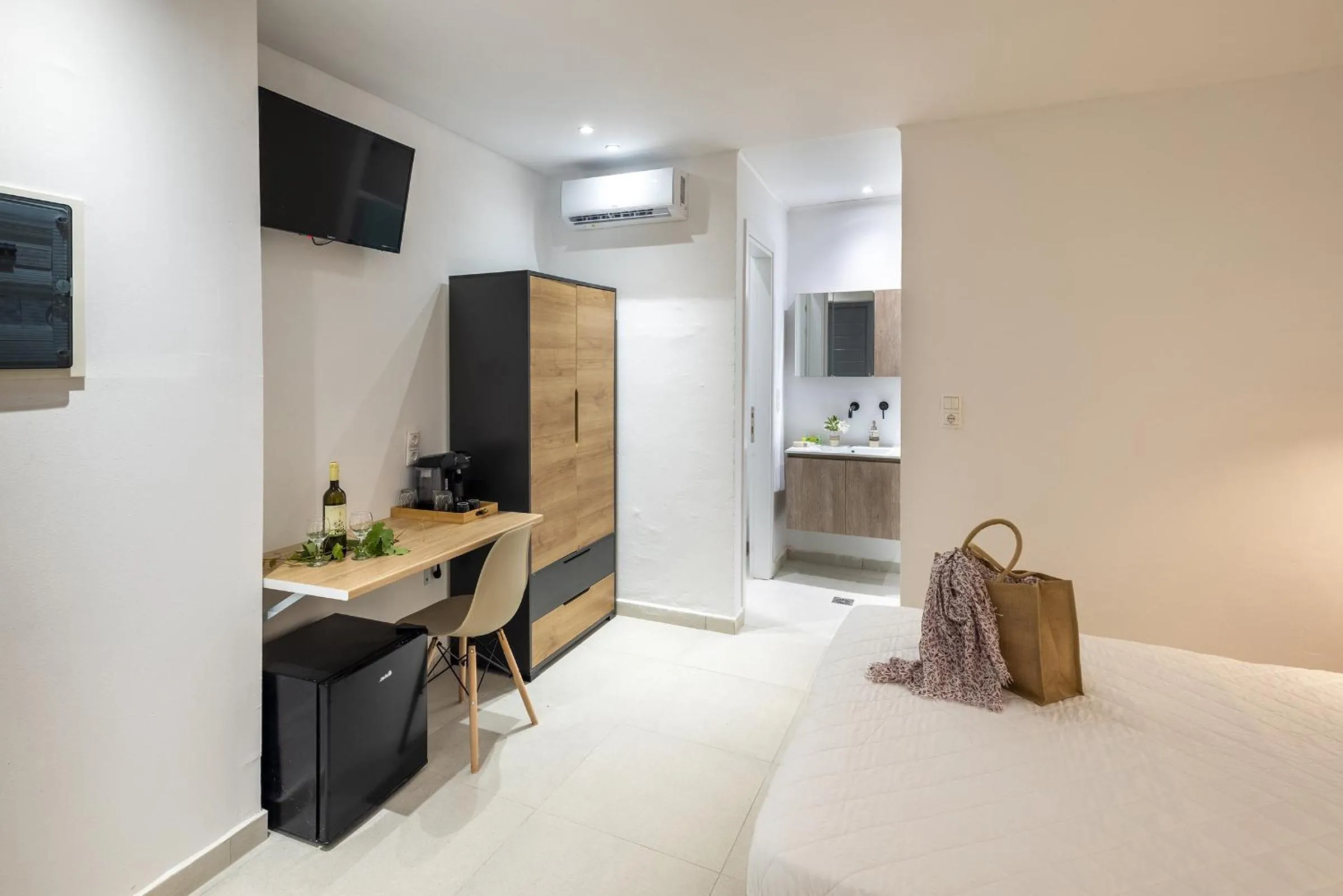 Bed in Chrysonisos Suites with Sunset & Seaviews near Kini