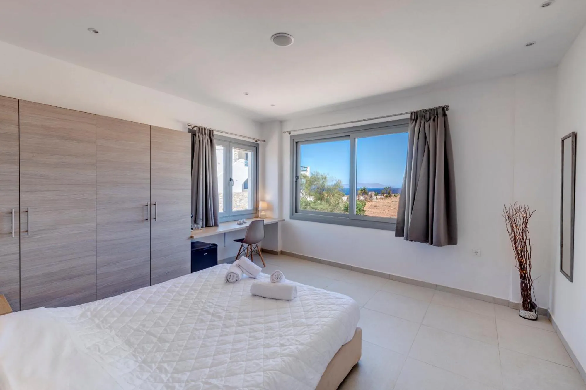 Bedroom, Bed in Chrysonisos Suites with Sunset & Seaviews near Kini