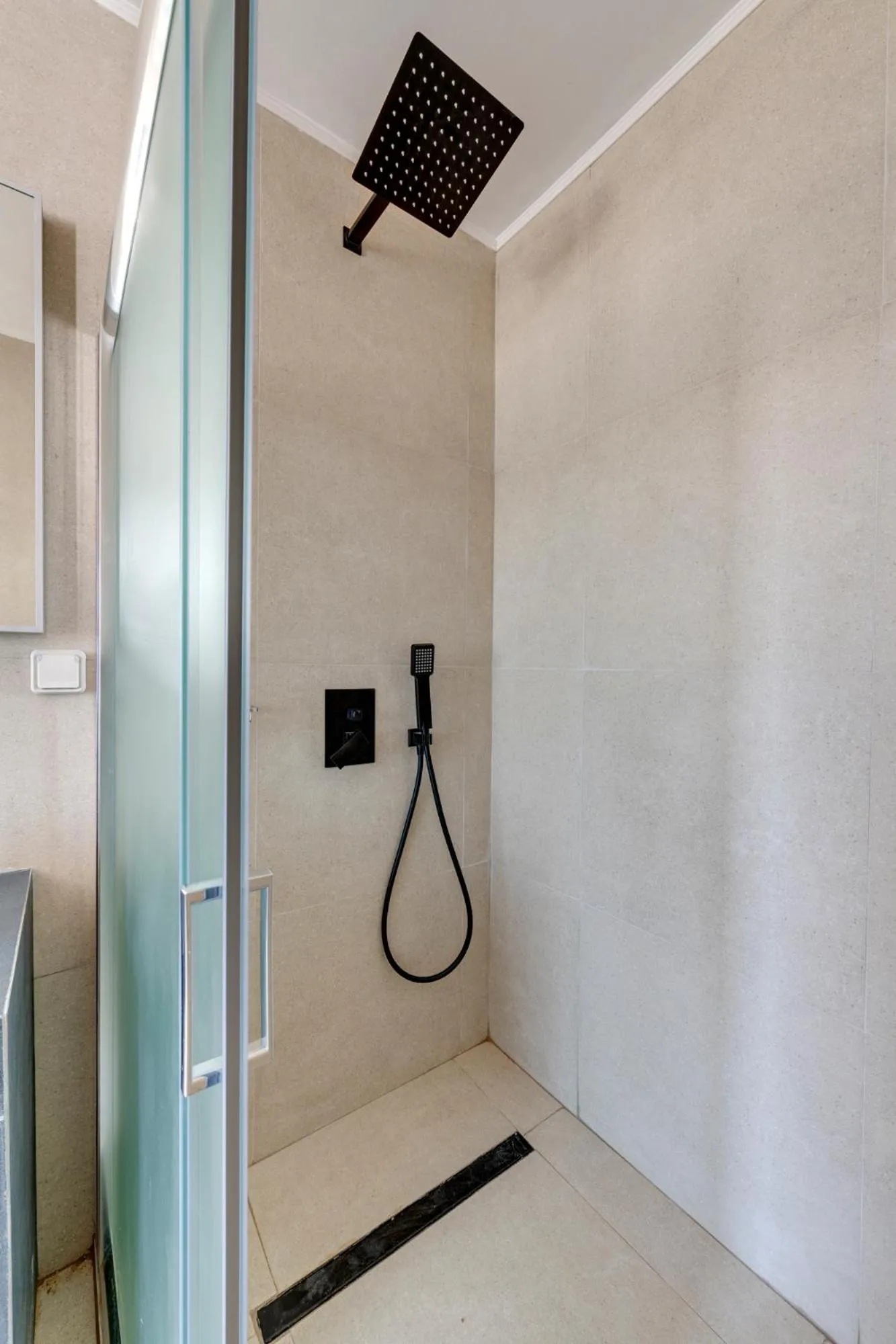 Shower in Chrysonisos Suites with Sunset & Seaviews near Kini