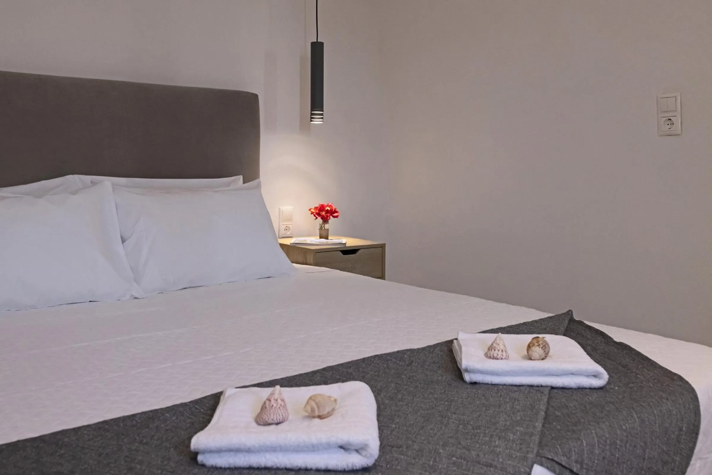 Bed in Chrysonisos Suites with Sunset & Seaviews near Kini