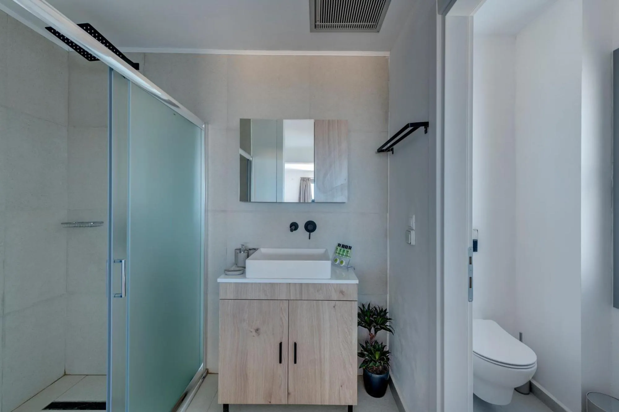 Bathroom in Chrysonisos Suites with Sunset & Seaviews near Kini