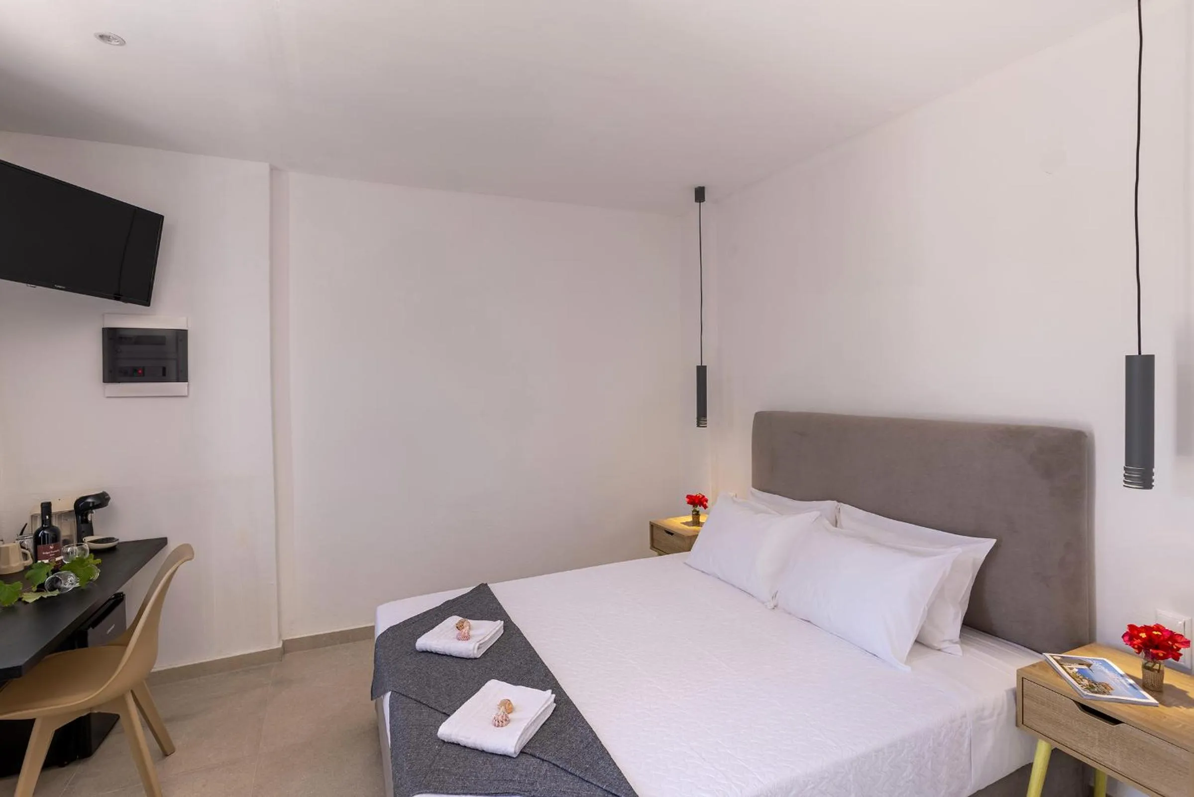 Bed in Chrysonisos Suites with Sunset & Seaviews near Kini