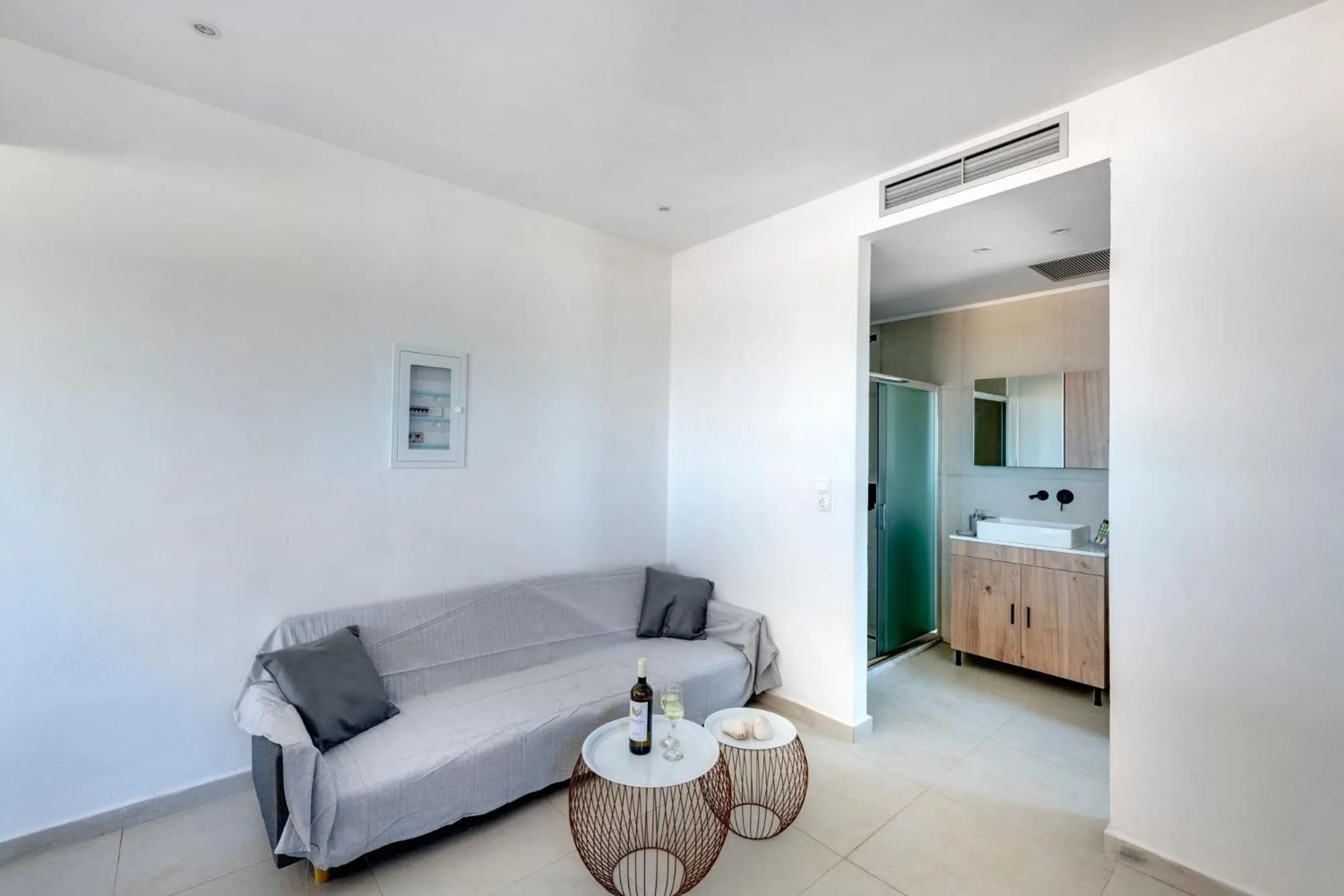 Living room, Bed in Chrysonisos Suites with Sunset & Seaviews near Kini