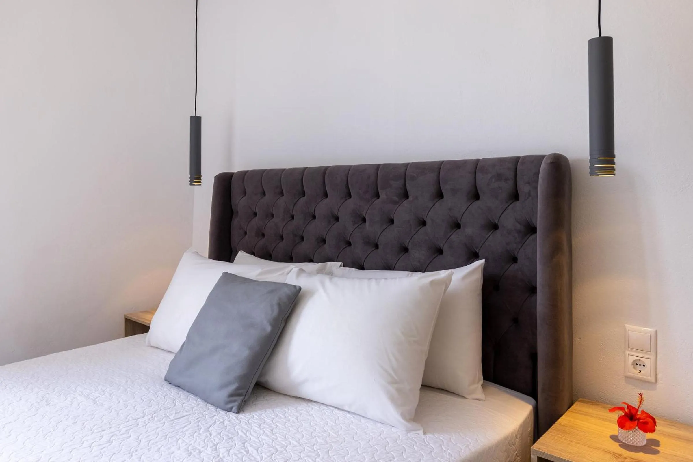 Bed in Chrysonisos Suites with Sunset & Seaviews near Kini