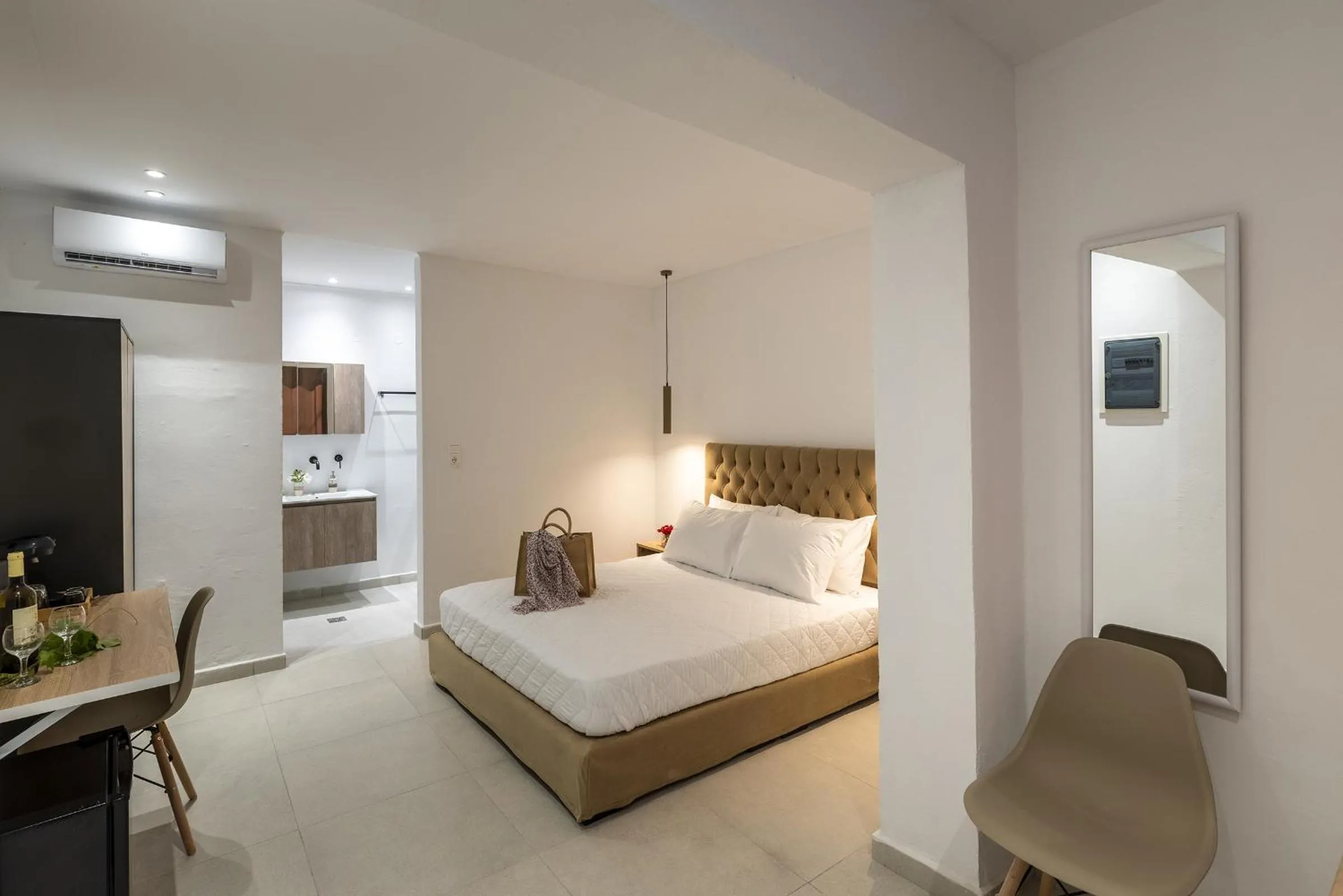 Bed in Chrysonisos Suites with Sunset & Seaviews near Kini