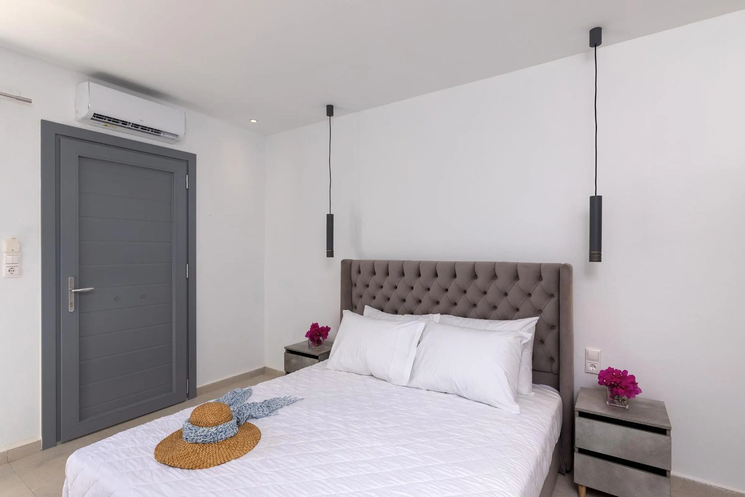 Bed in Chrysonisos Suites with Sunset & Seaviews near Kini
