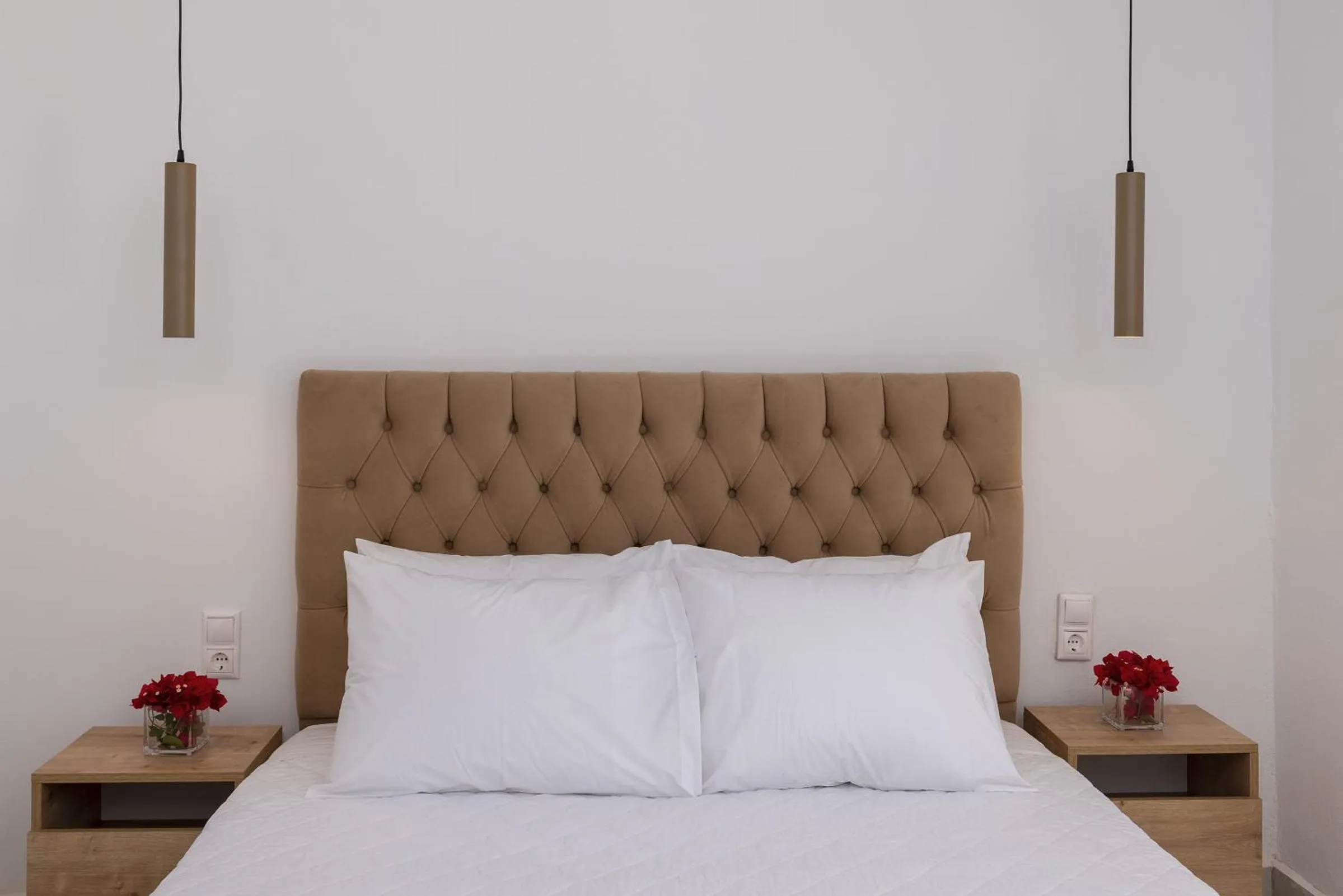 Bed in Chrysonisos Suites with Sunset & Seaviews near Kini