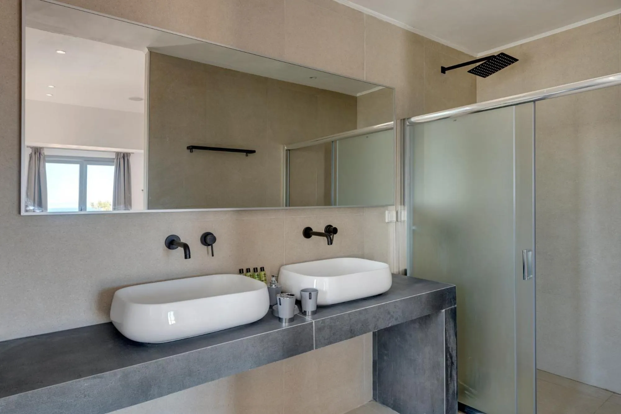 Bathroom in Chrysonisos Suites with Sunset & Seaviews near Kini