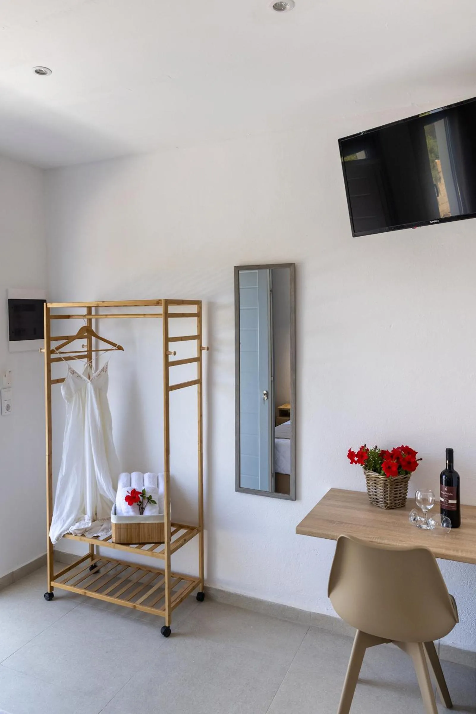 Photo of the whole room, Bed in Chrysonisos Suites with Sunset & Seaviews near Kini
