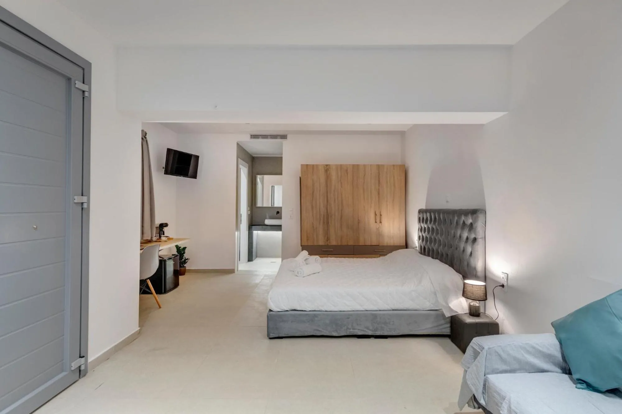 Bed in Chrysonisos Suites with Sunset & Seaviews near Kini