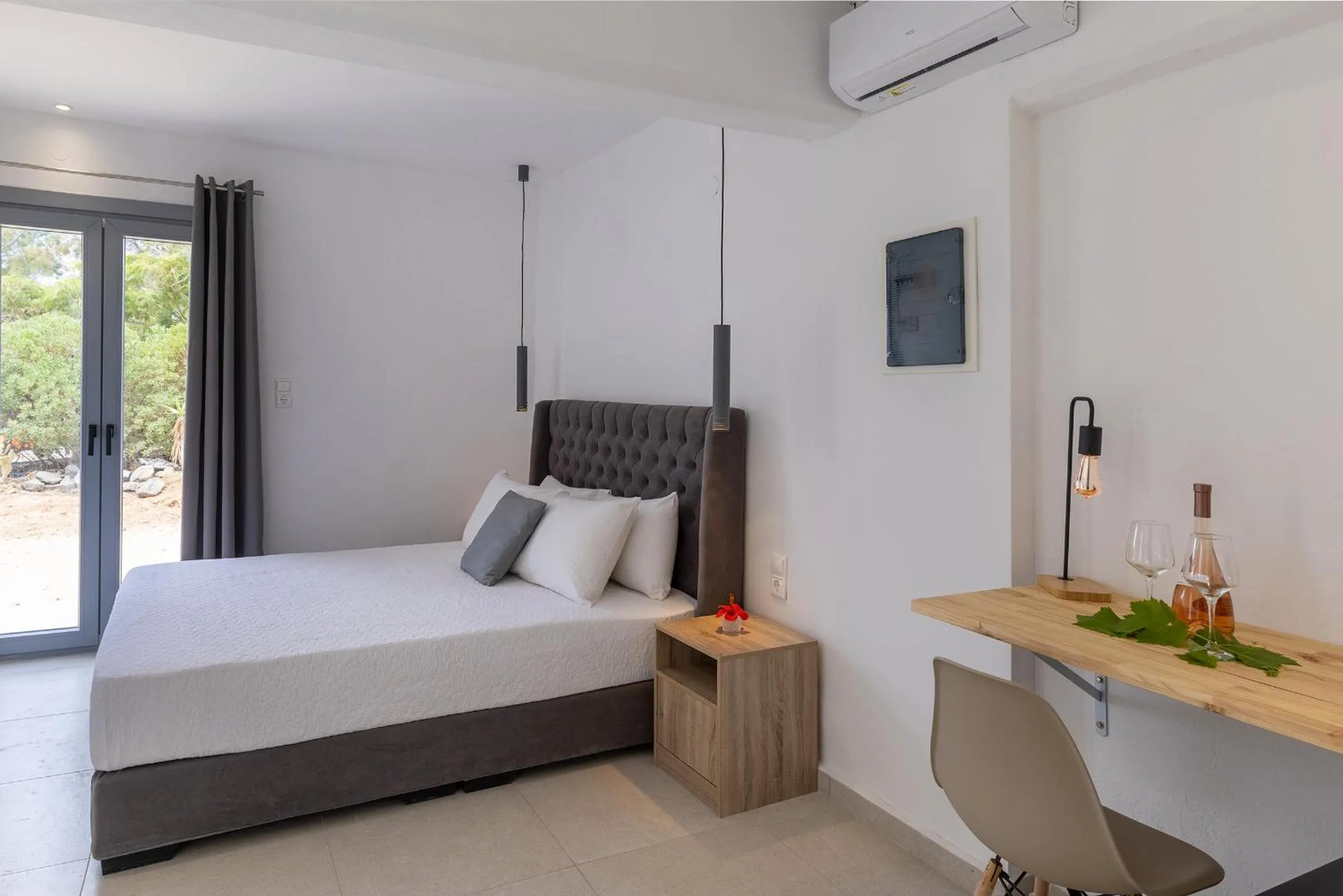Bed in Chrysonisos Suites with Sunset & Seaviews near Kini