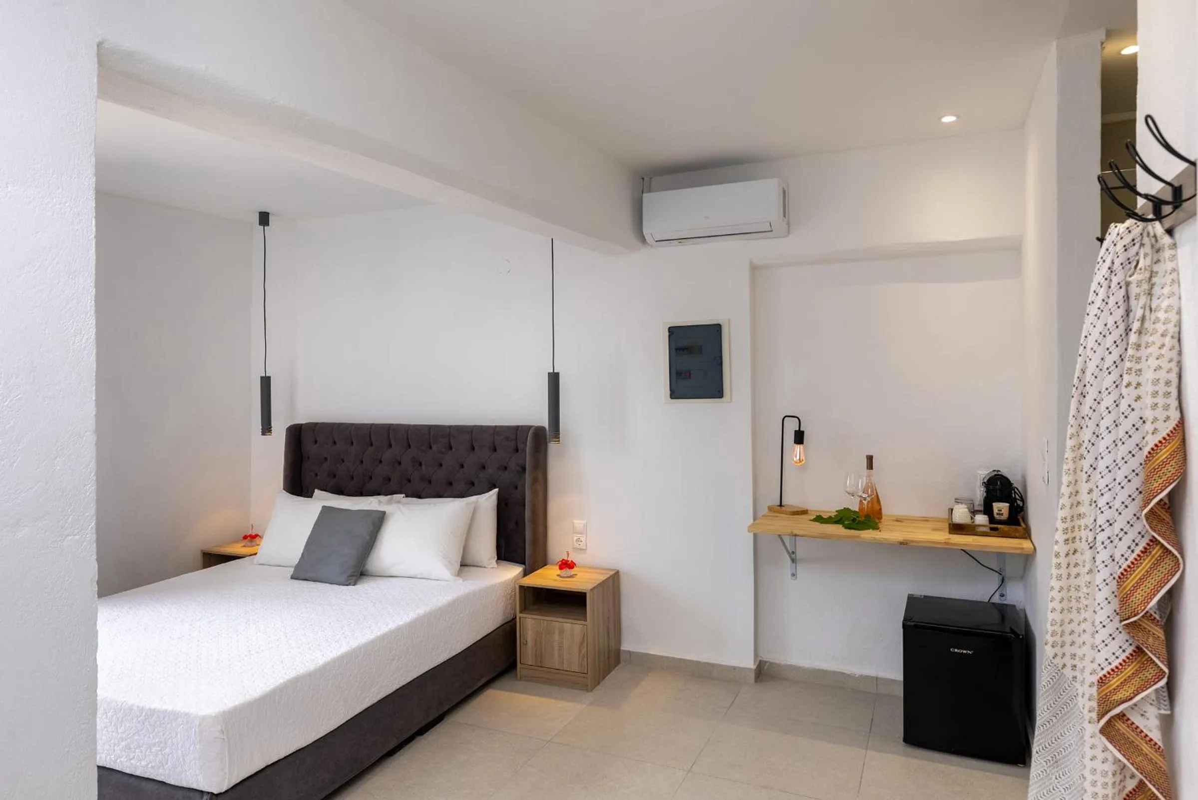 Bed in Chrysonisos Suites with Sunset & Seaviews near Kini