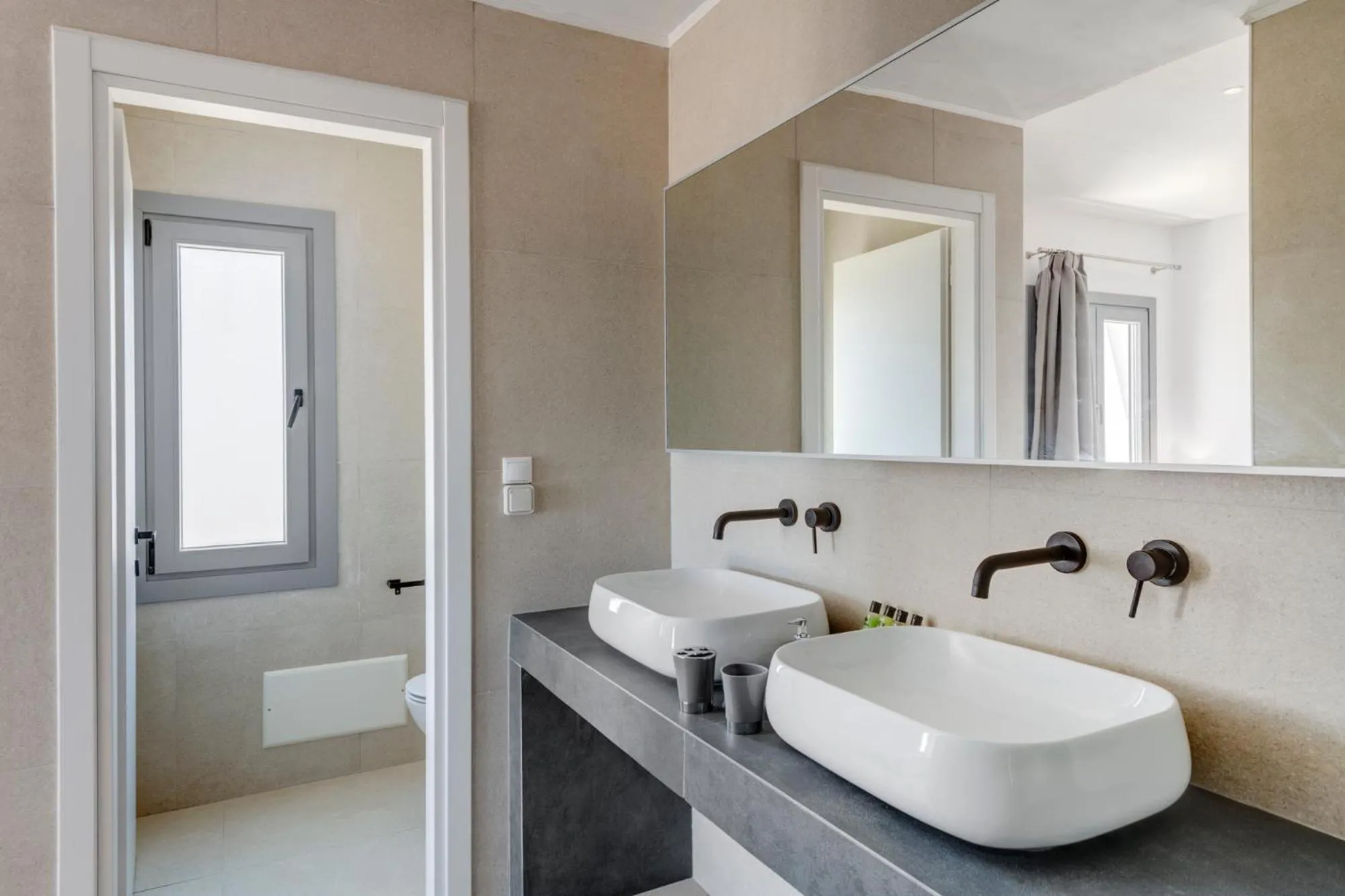 Bathroom in Chrysonisos Suites with Sunset & Seaviews near Kini