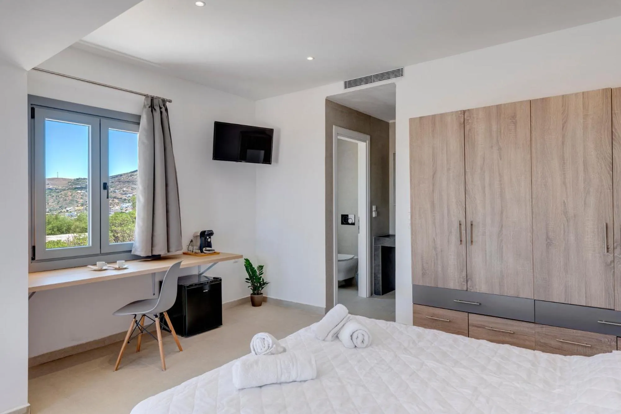 Bedroom, Bed in Chrysonisos Suites with Sunset & Seaviews near Kini