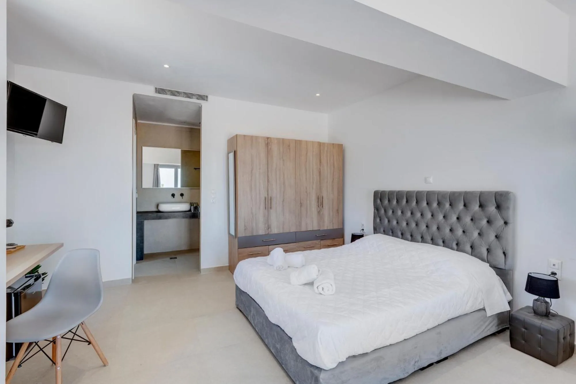 Bed in Chrysonisos Suites with Sunset & Seaviews near Kini